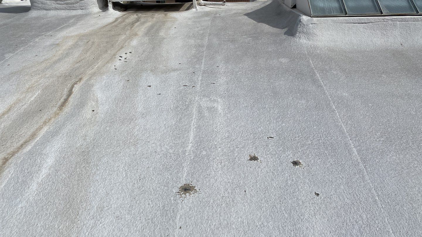 Polyurethane foam roof refurbish and recoating by Straight Edge Roofing Inc