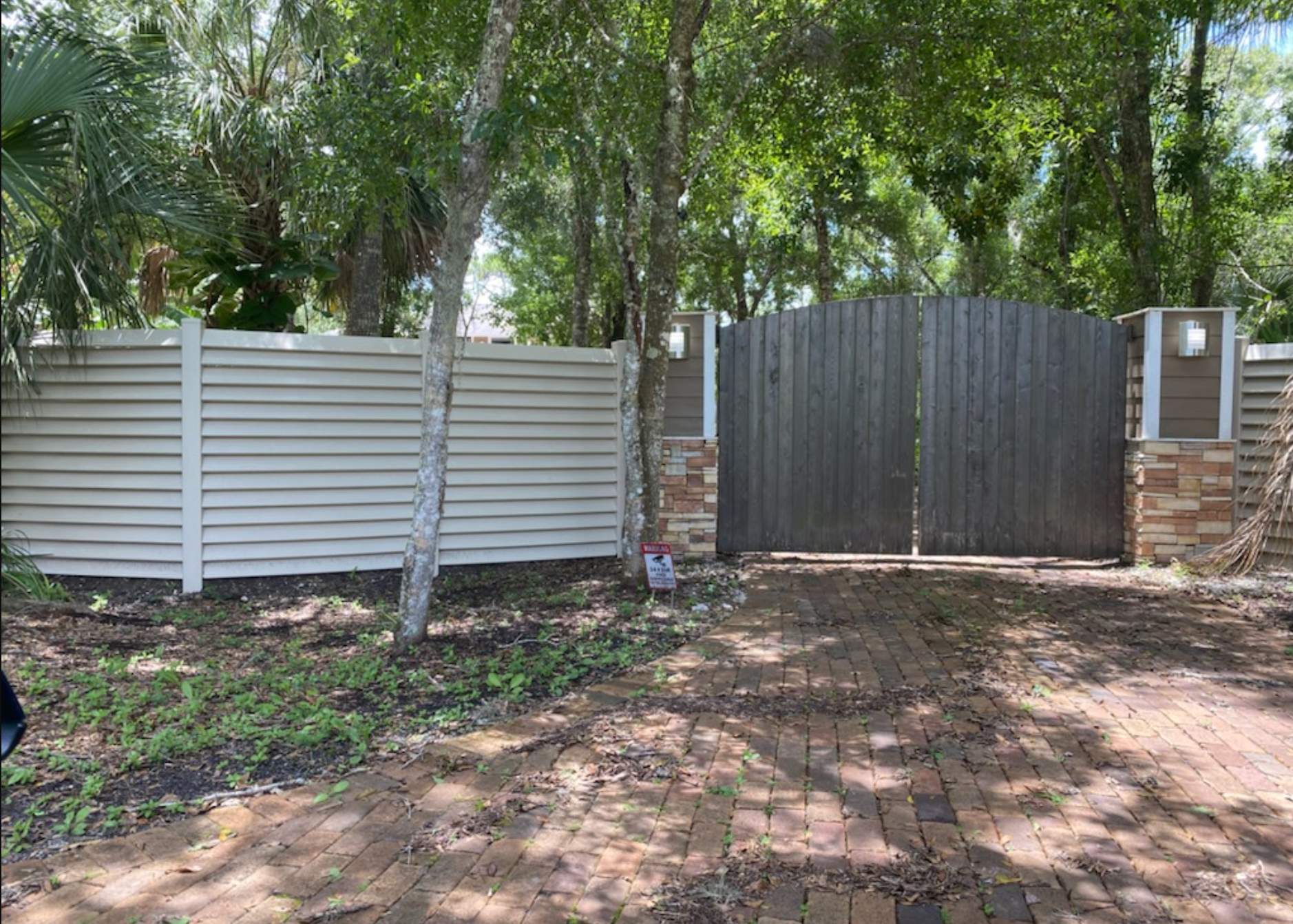 Sarasota, FL. Vinyl Fence Installation using Tan Vinyl Louvered Vinyl Fence by Asap fence and gates, LLC