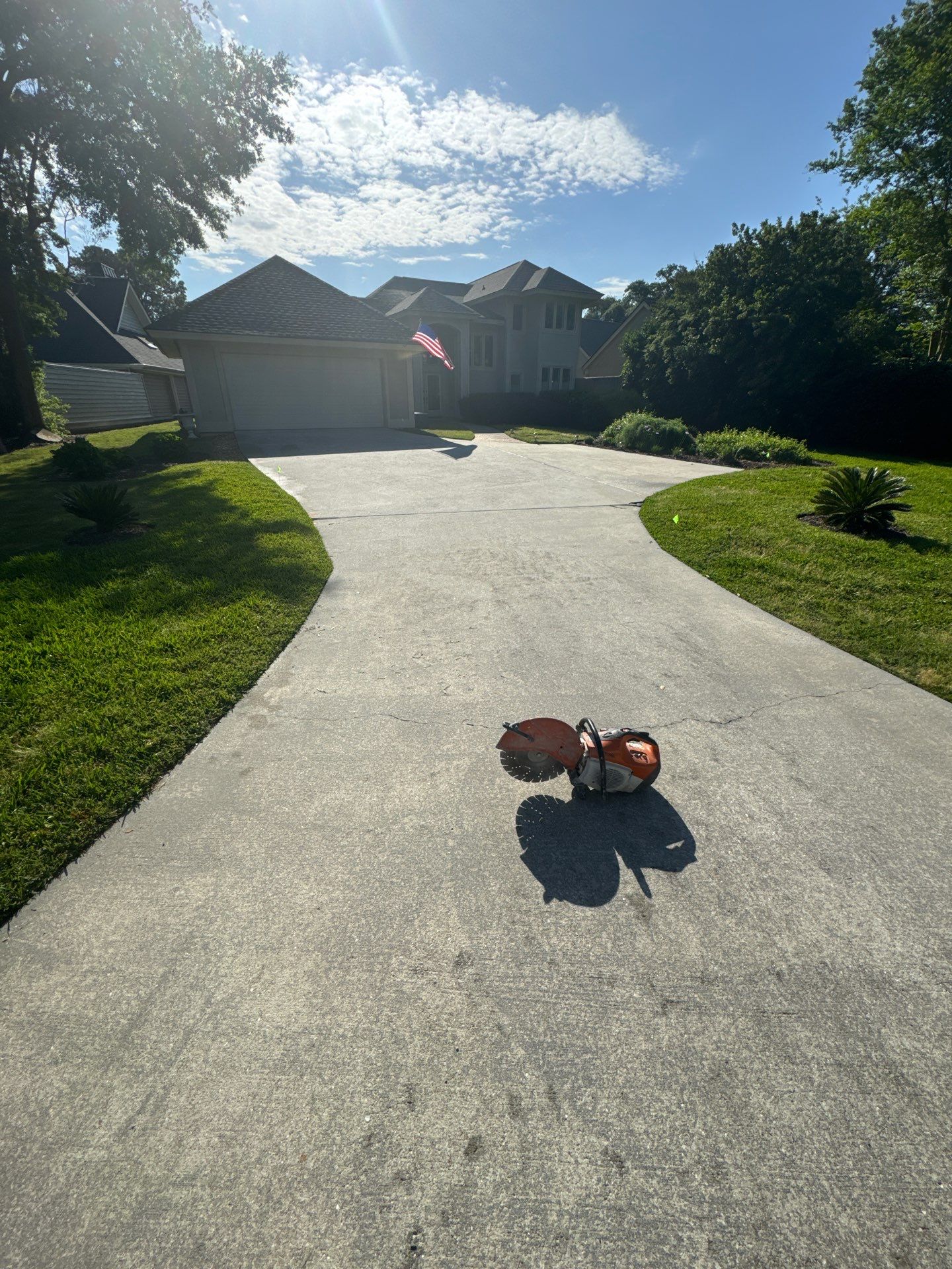 Concrete Driveway Repair with Decorative Paver Accents in Hilton Head Island by Lowcountry Scapes, LLC