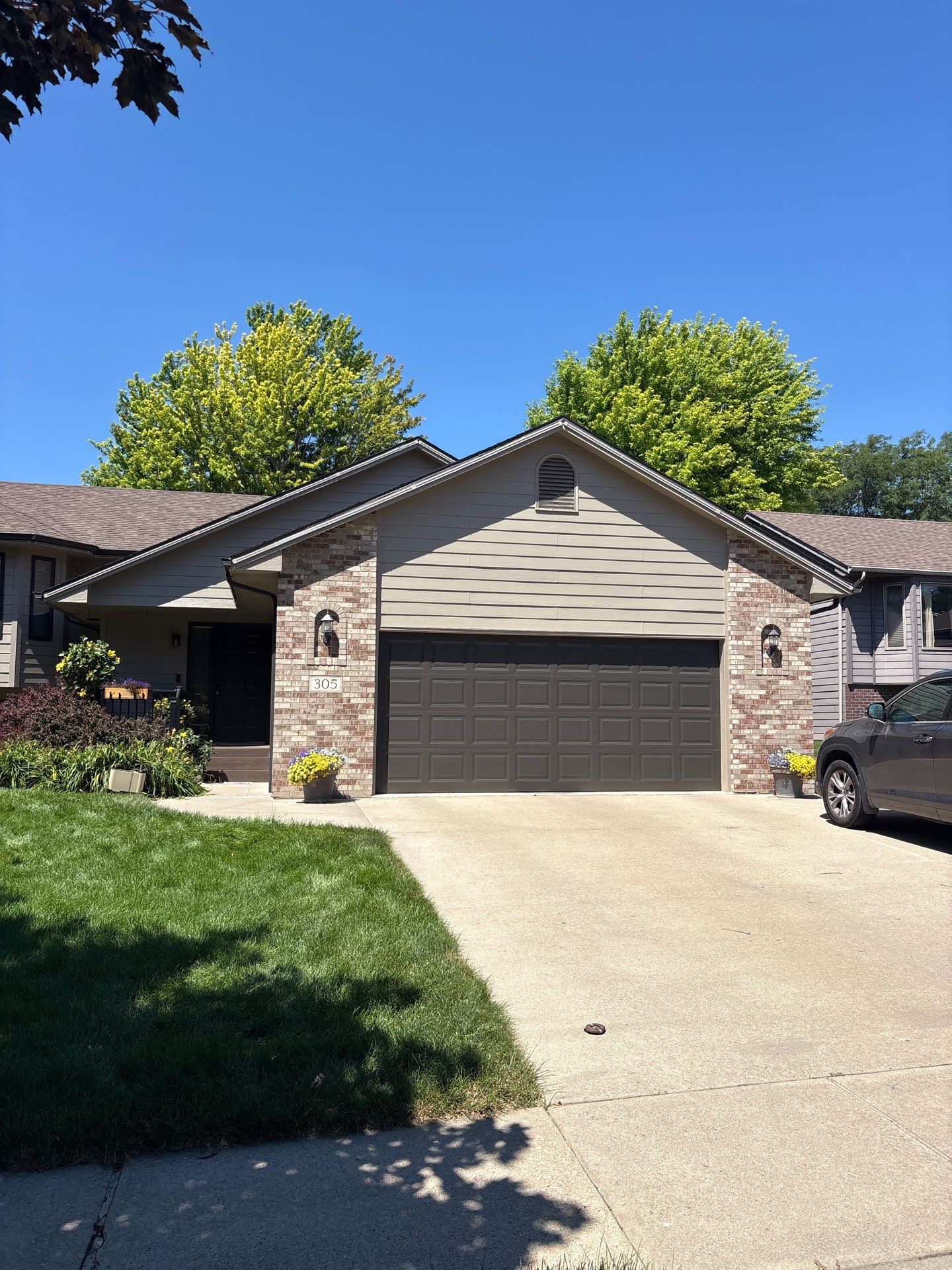 Residential Exterior Painting and Trim Restoration in Sioux Falls by Select Painting, Coatings & Garage Cabinets