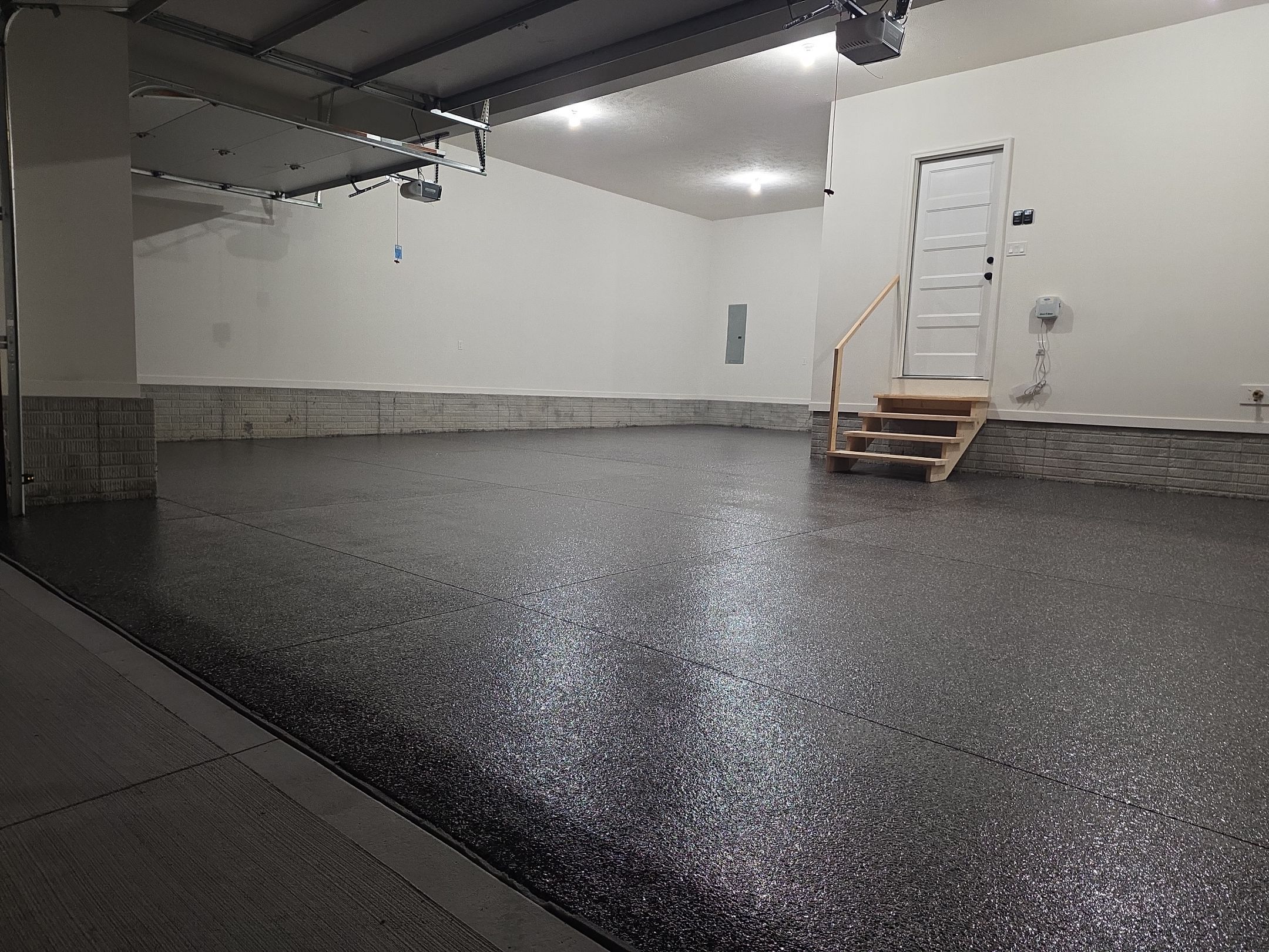 Husker-Style Garage by Revival Concrete Coatings