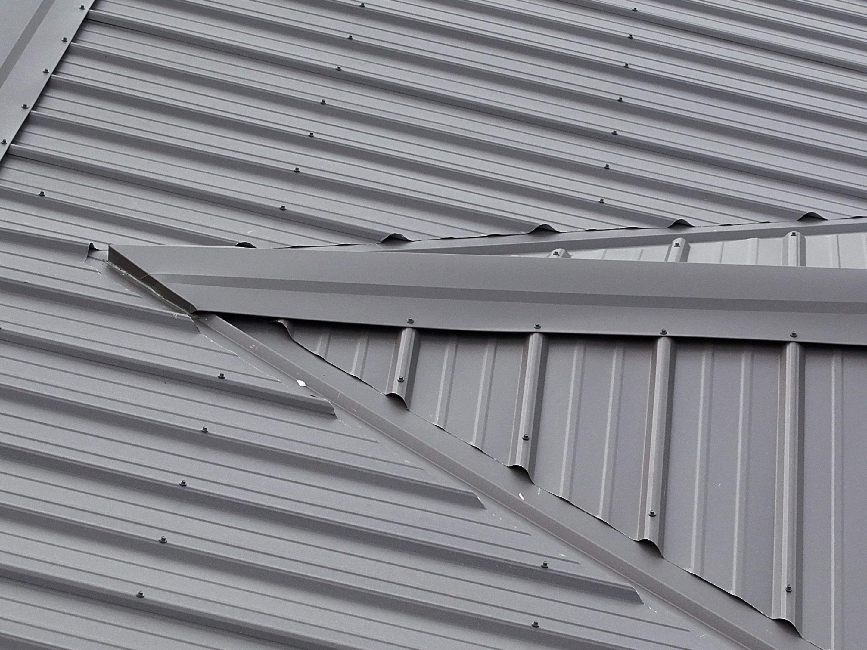 Charcoal Gray Textured Metal Roof by Omnia Roofing