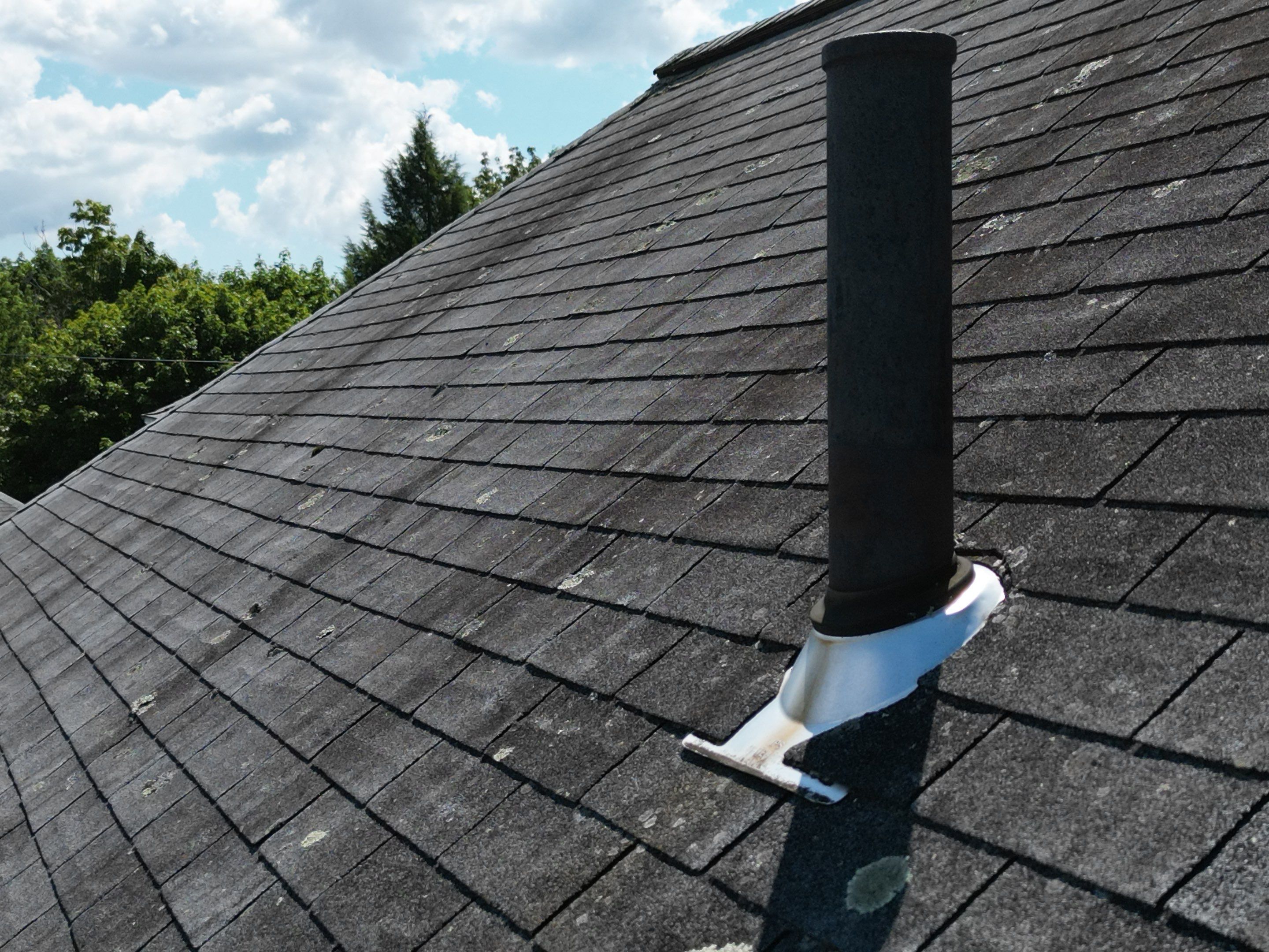 Roof Replacement with Skylight Flashing in Waltham, MA by Mighty Dog Roofing of Greater Middlesex County
