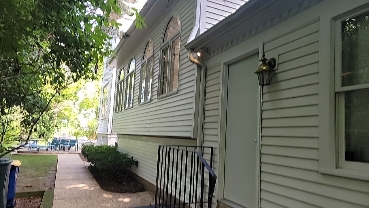 Housewashing  using Algaecide, soft wash soap by Northern Power Washing LLC.