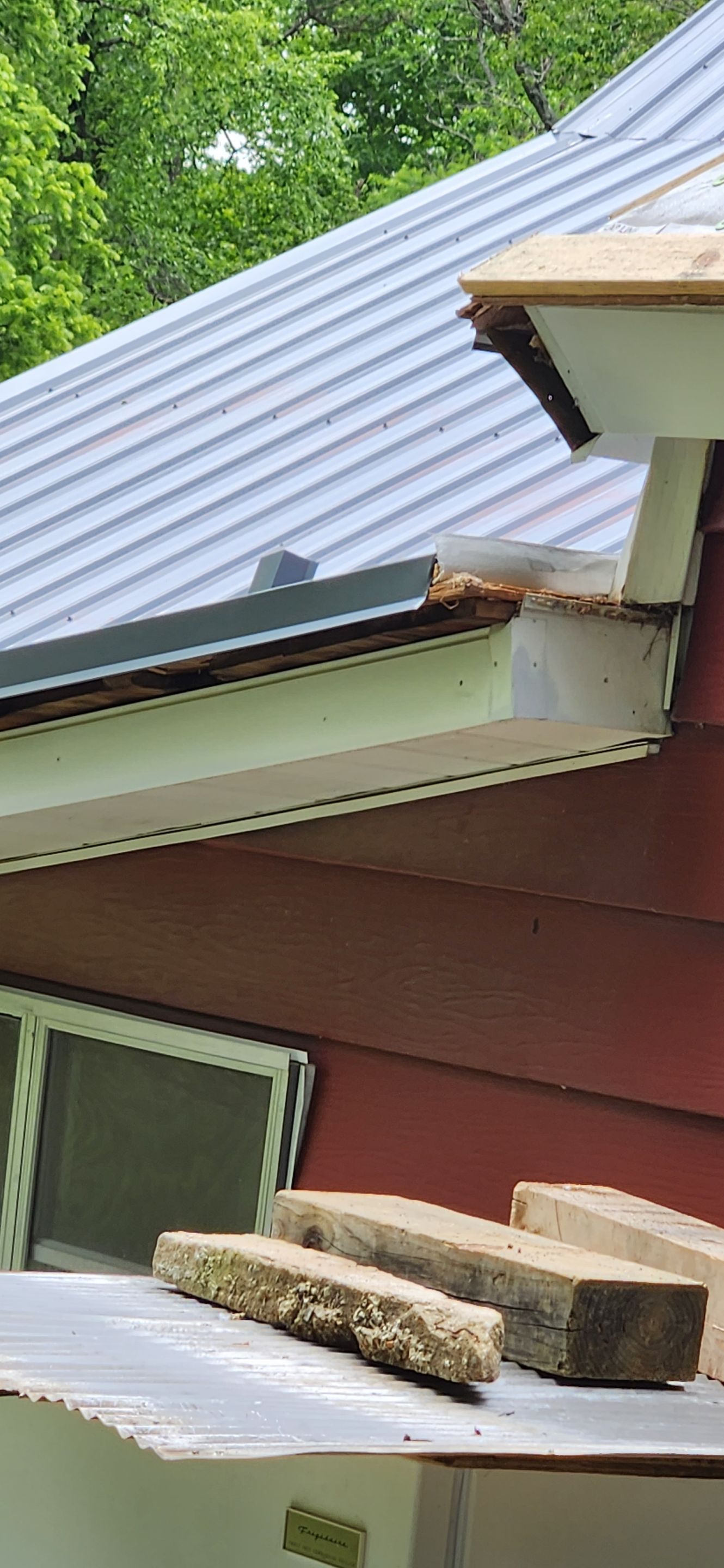 Residential Roofing Installation using 26 Gauge Colored Panels by Hostetler Roofing