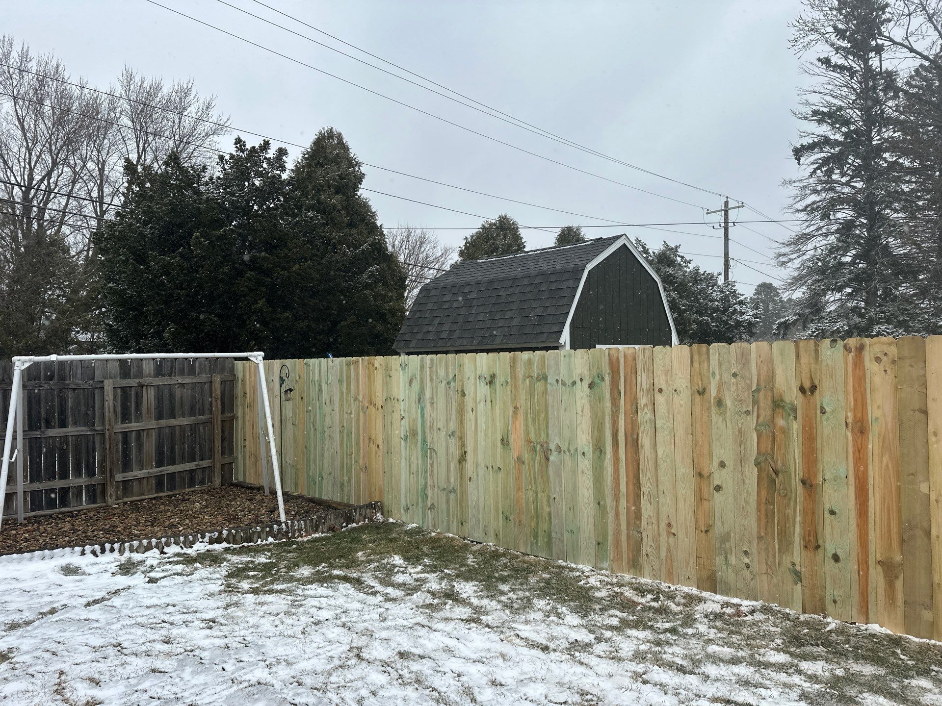 Pressure-Treated Wood Privacy Fence Replacement in Waterloo by Perfect Picket Fence and Stain