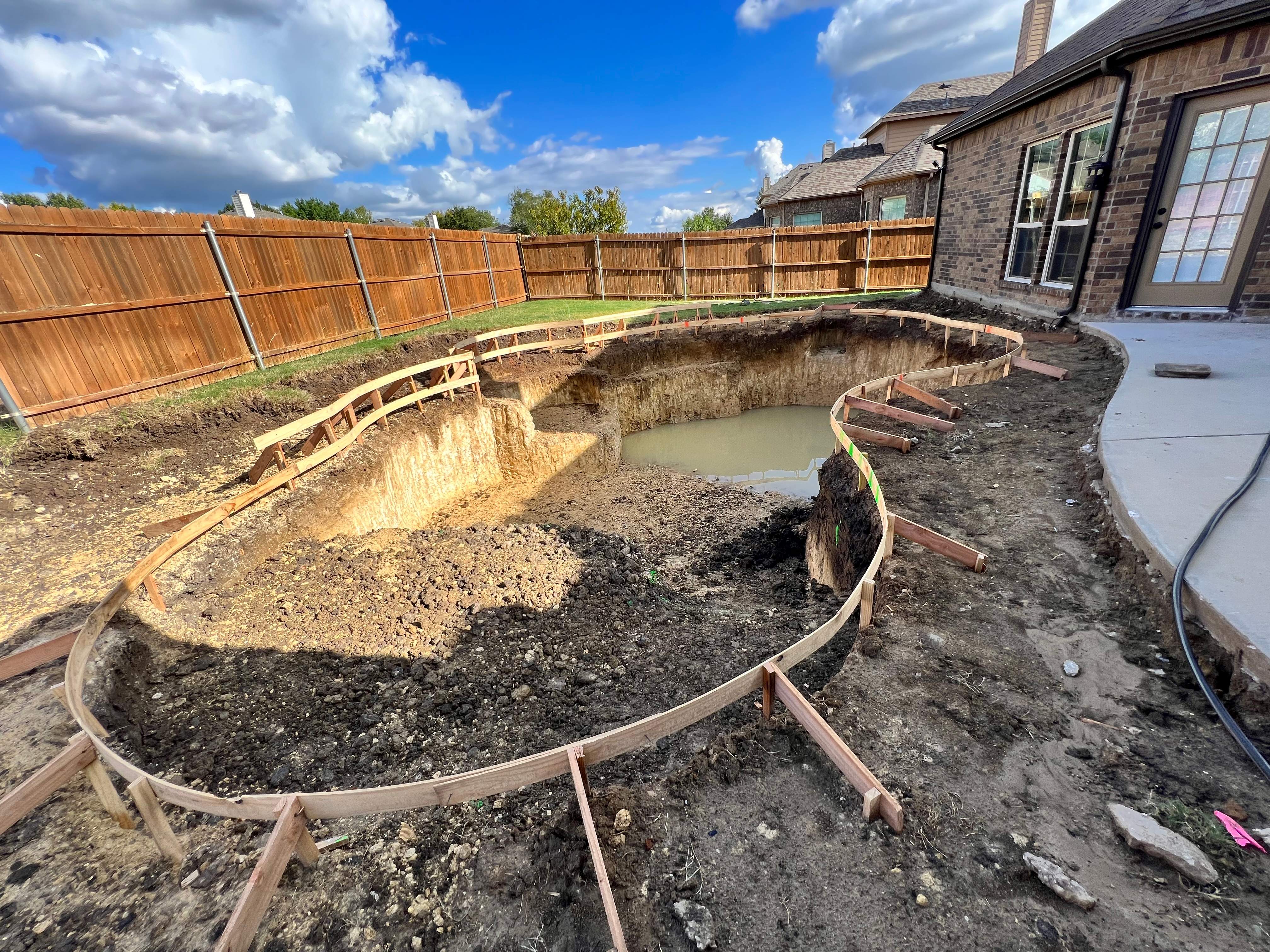 Freeform Pool with Raised Stone Spa by Pinnacle Pools and Spas - DFW