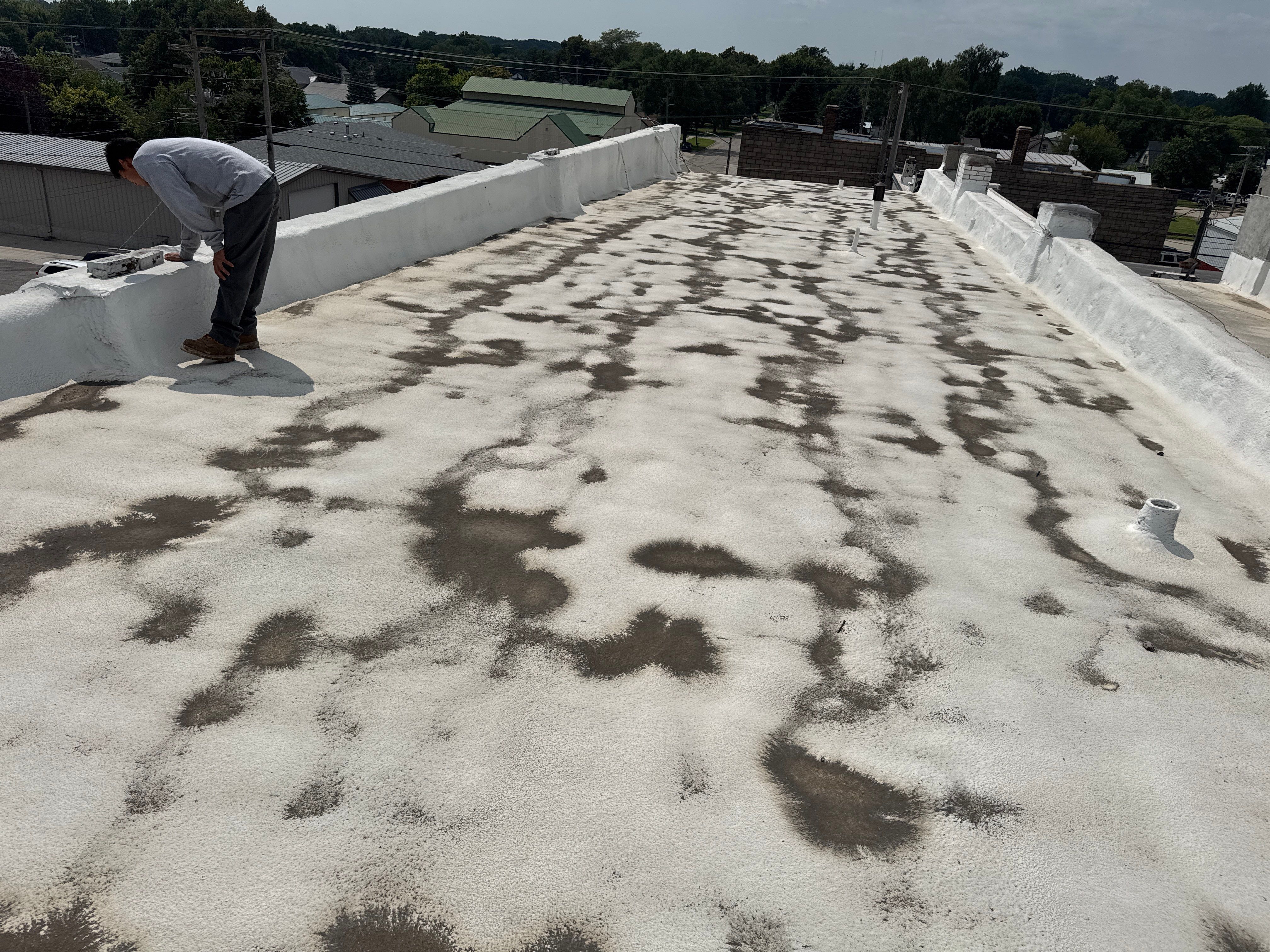 Commercial Flat Roof Elastomeric Coating and Repair in West Point by Crows Roofing LLC