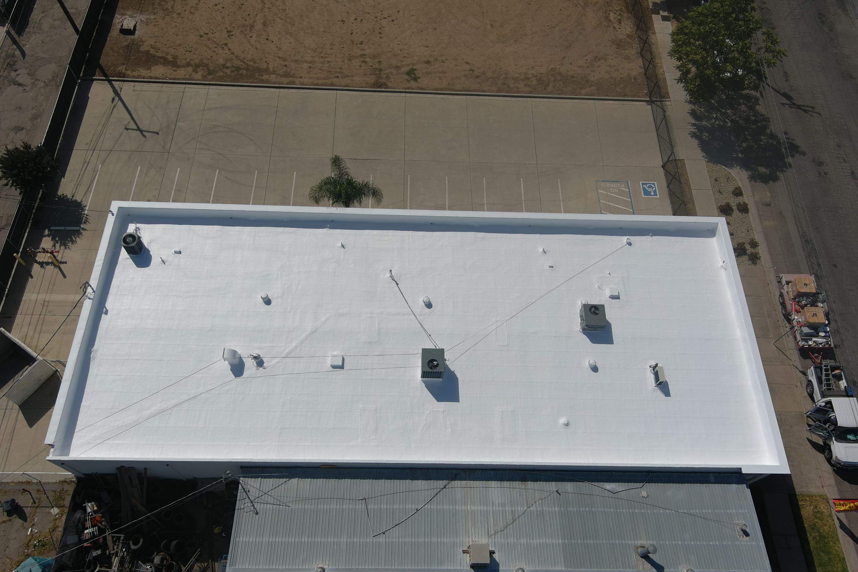 Spray foam and coatings using Conklin Benchmark/PUMA XL coatings and spray foam by Straight Edge Roofing Inc