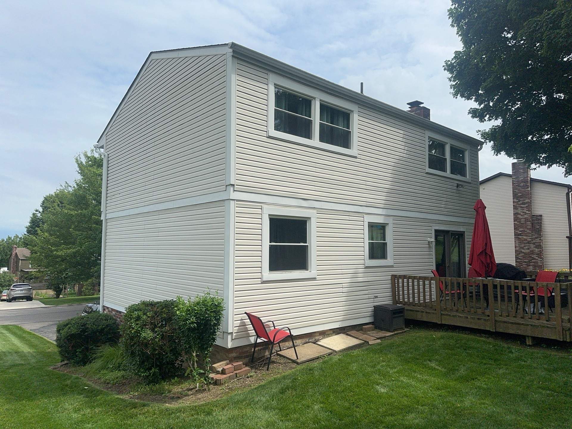 Bridgeville Composite Deck Build with White Railings and Versalok Retaining Wall by Cousins Roofing Siding & Decks