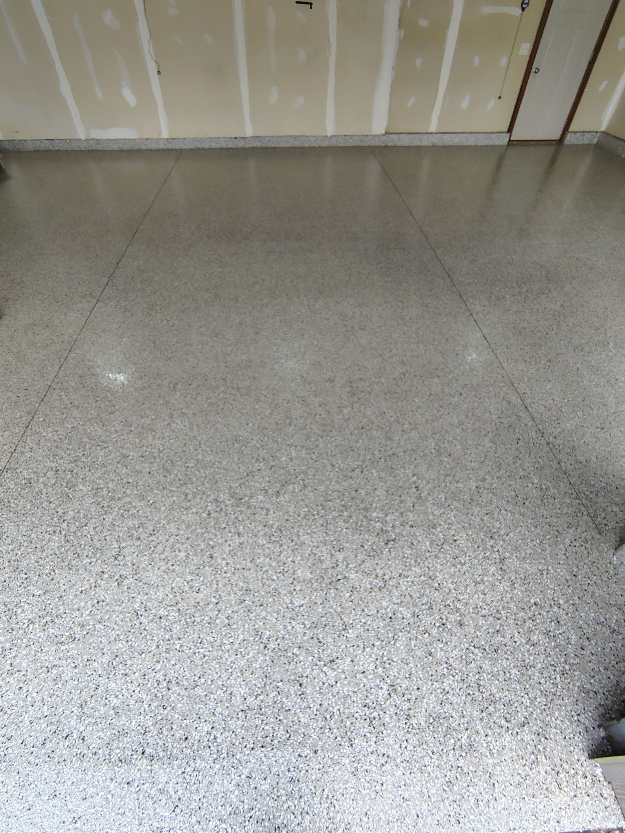 Multi-Car Garage Concrete Coating and Epoxy Finish in Sioux Falls by Select Painting, Coatings & Garage Cabinets