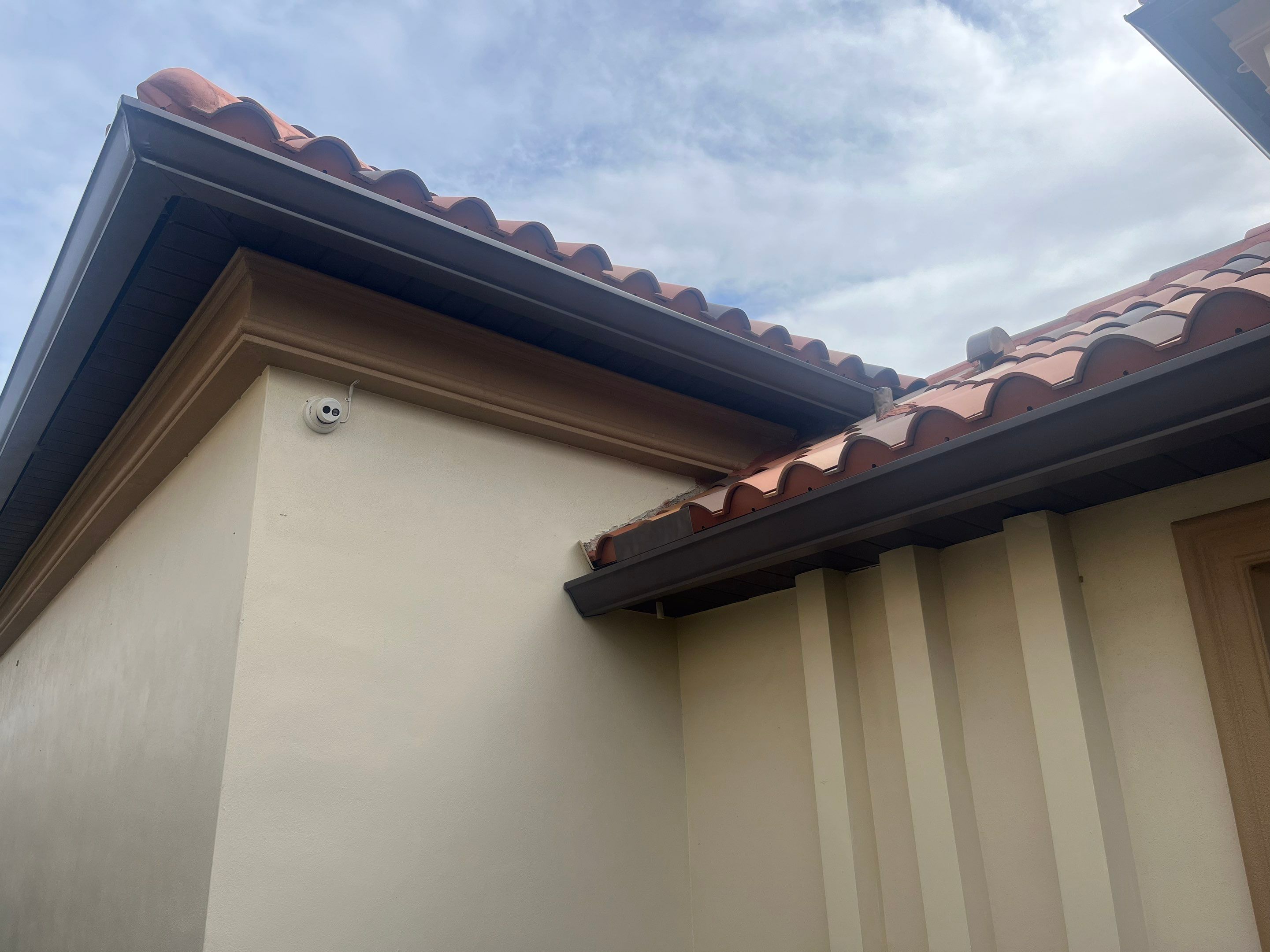Musket Brown Seamless Gutters using Musket Brown Seamless Gutters in Cape Coral FL by Gutter Professors