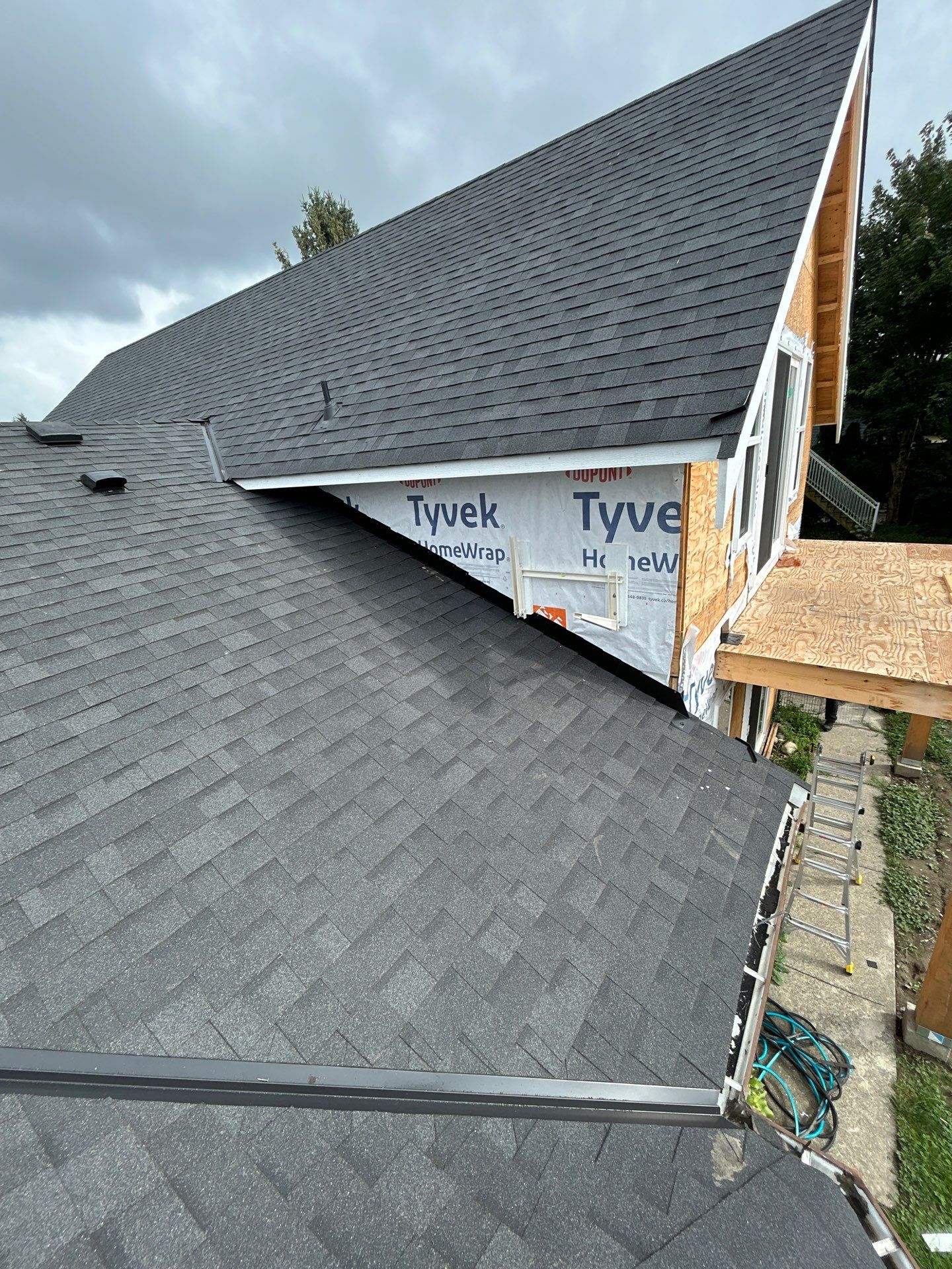 Residential Roofing Installation using OC onyxs black shingle by Top Notch Roofing Inc