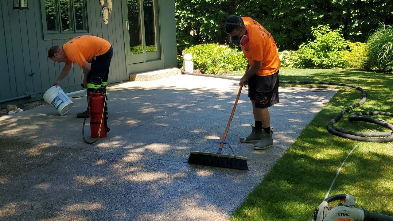 Aggregate concrete cleaning and sealing using Surebond SB-9000 by Northern Power Washing LLC.