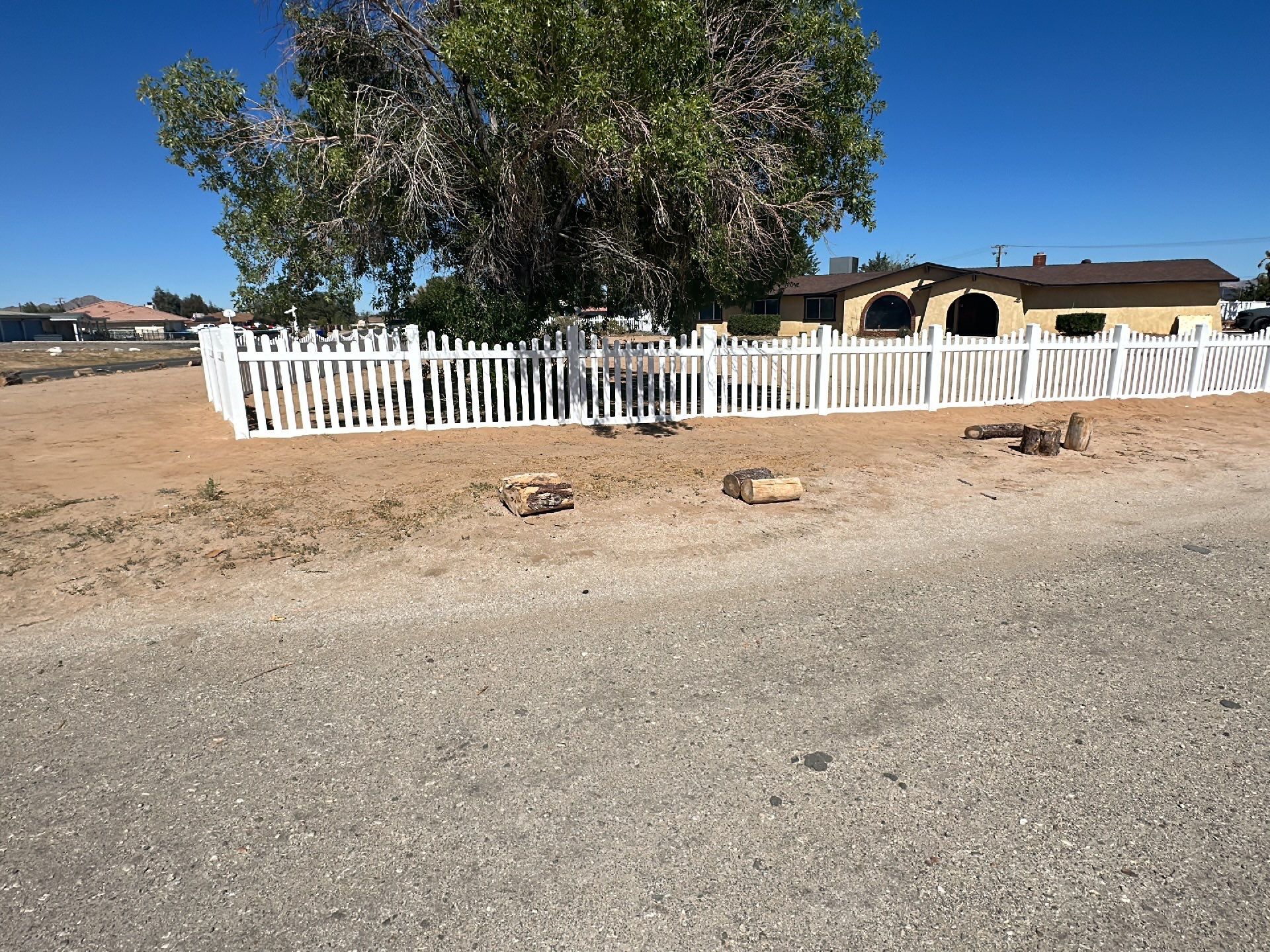 White picket fence  by Fence Guys Inc. 