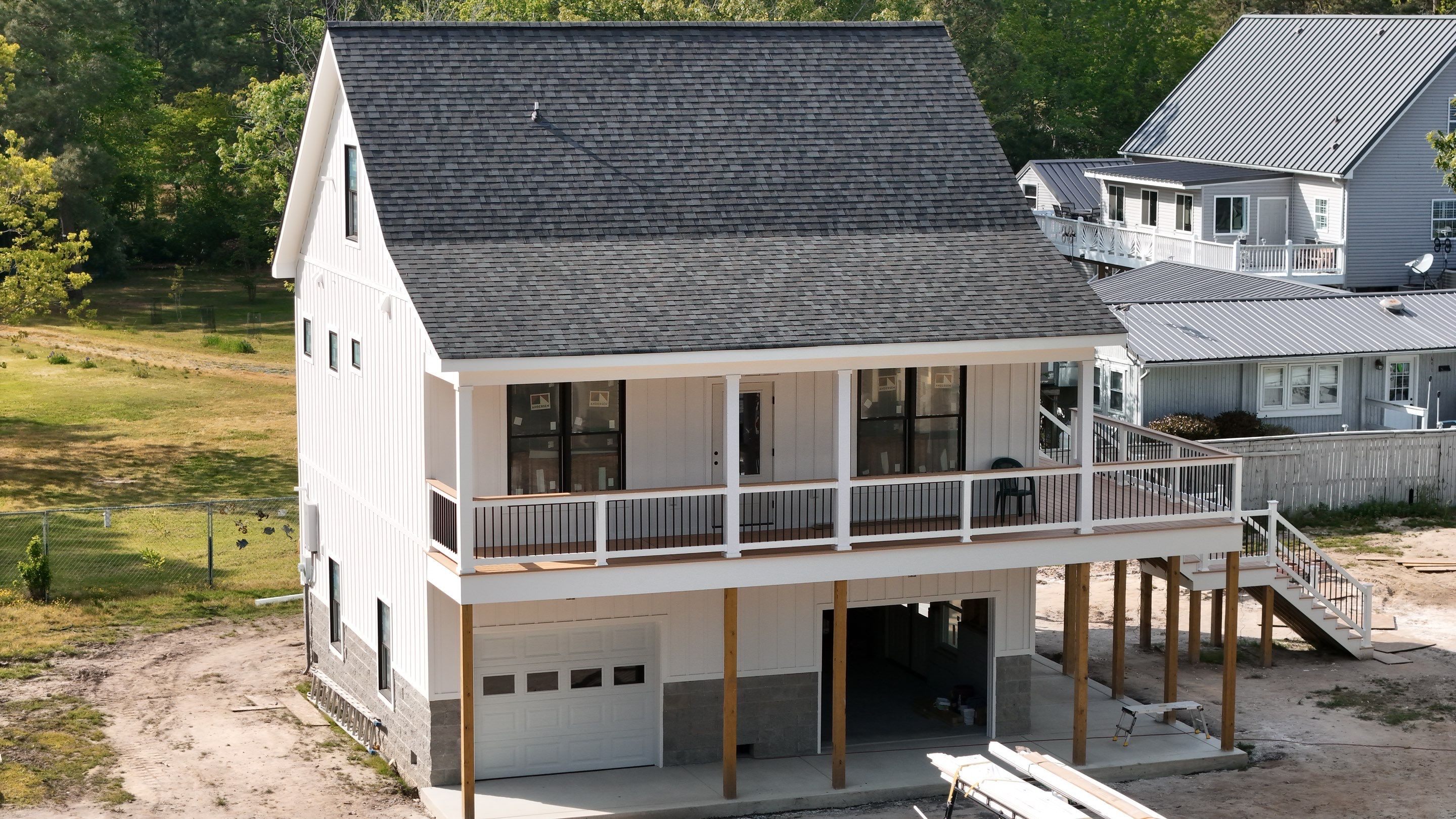 Two-Story Custom Home With Board and Batten Siding by Cade Construction