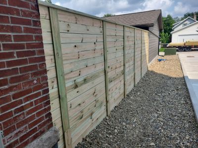 Modern Horizontal Slat Wood Privacy Fence Installation in Cedar Falls