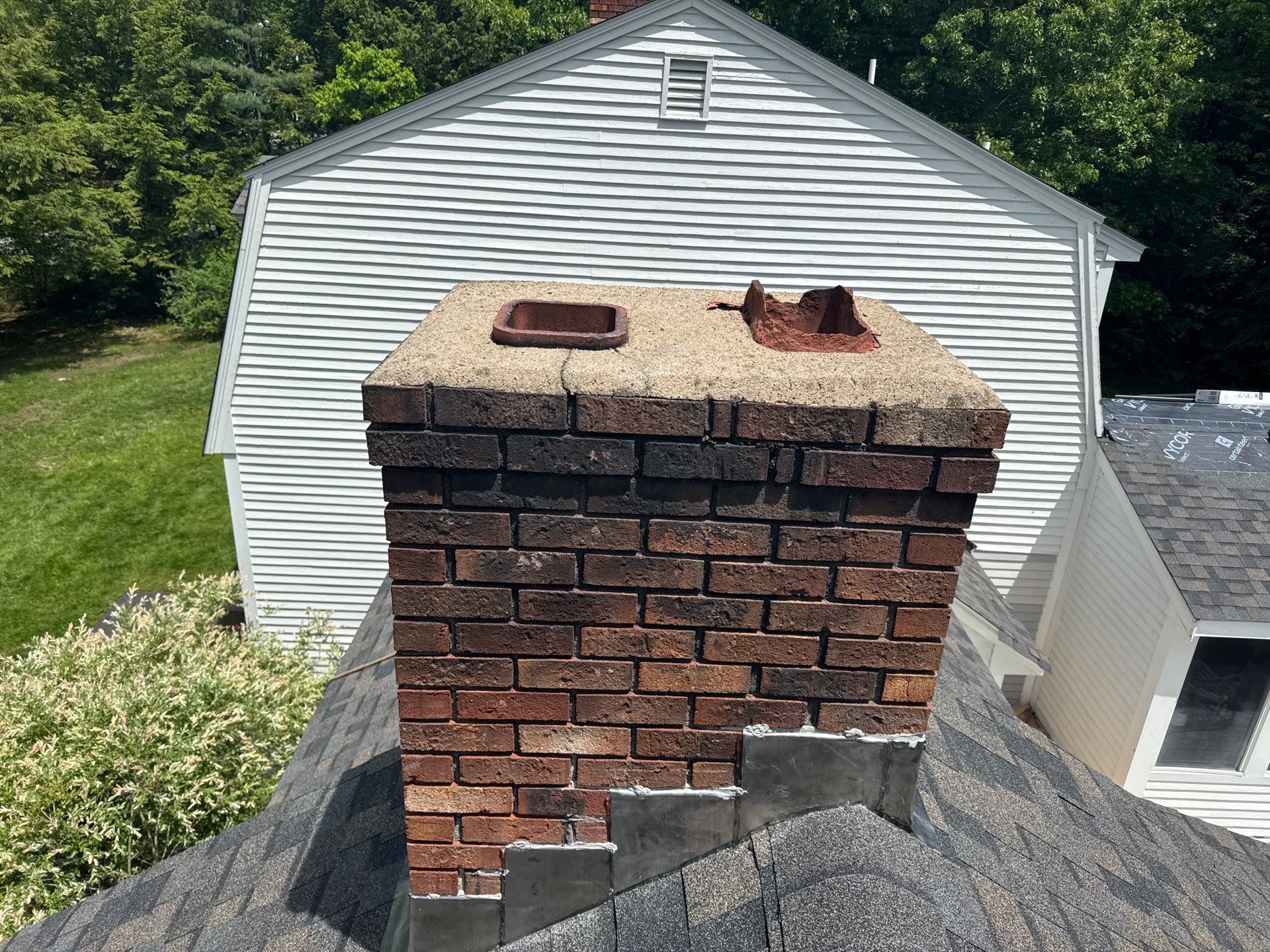 Bedford, NH Roof Replacement with Rot Repair, New Skylights & Owens Corning Duration Peppercorn Shingles by Compass exteriors