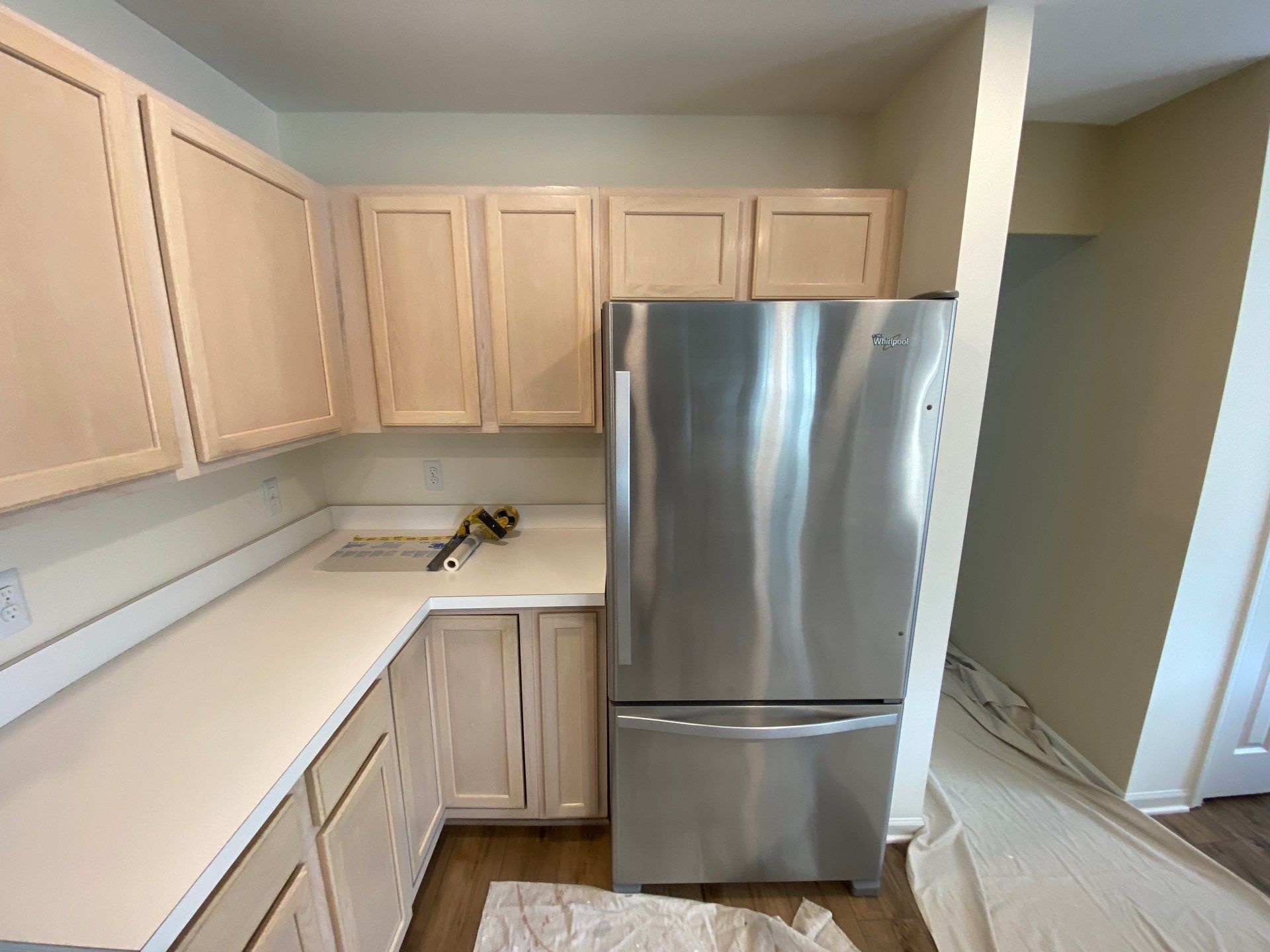 White Shaker Cabinet Installation and Quartz Countertop Replacement in Rochester by Top Shelf Painter