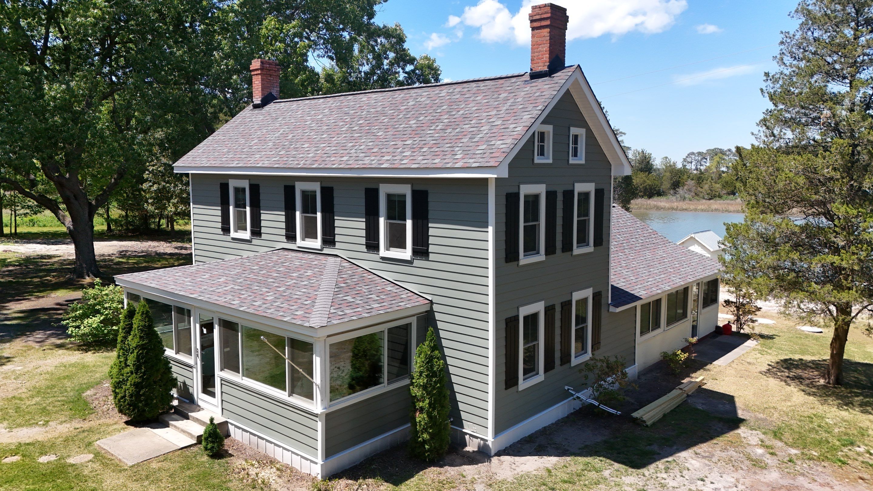 Waterfront Exterior Renovation in Port Haywood by Cade Construction