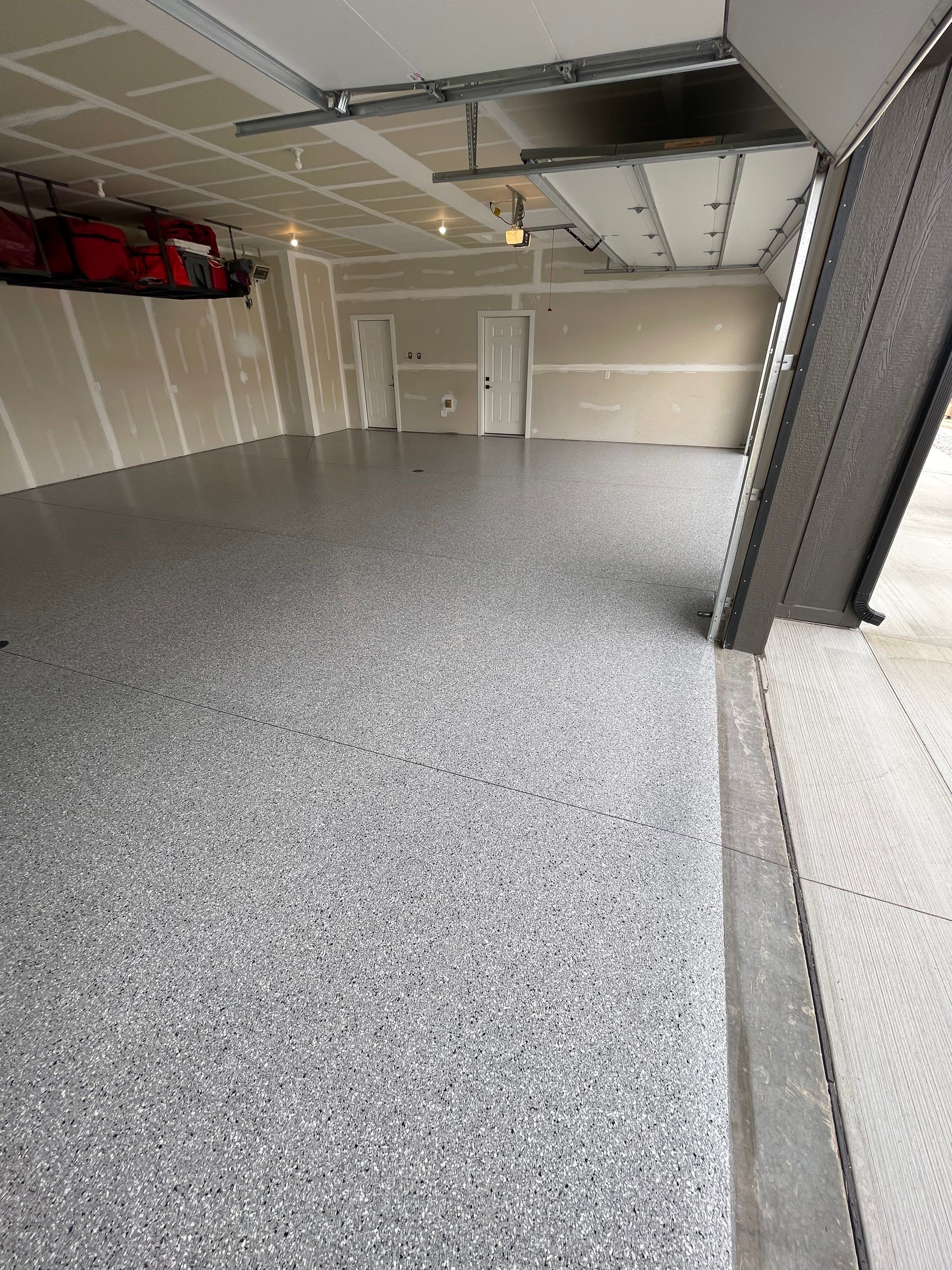 Grey Speckled Epoxy Floor Coating for Sioux Falls Garage by Select Painting, Coatings & Garage Cabinets