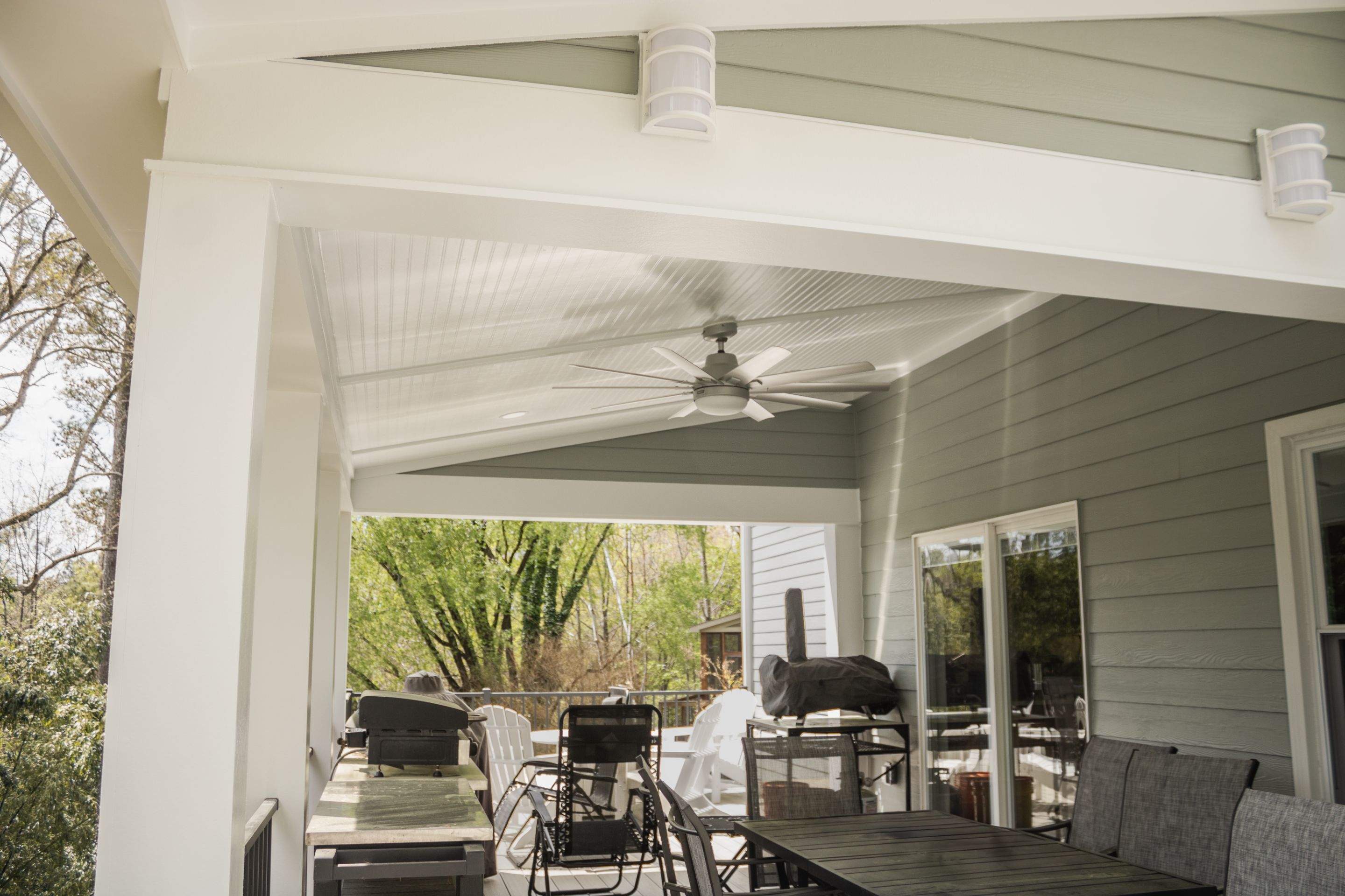 Covered Porch and Deck Build using Deckorators Venture Series Decking and Trex Select Aluminum Railing by Nelson Exteriors