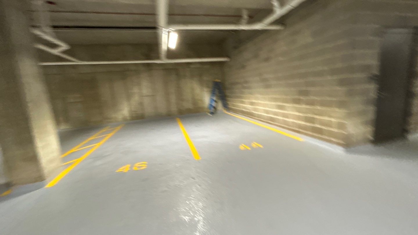 Parking garage using Hot water by Northern Power Washing LLC.