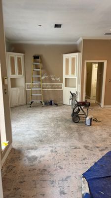 Interior Renovation with Dark Wood Floors and Geometric Fireplace Tile