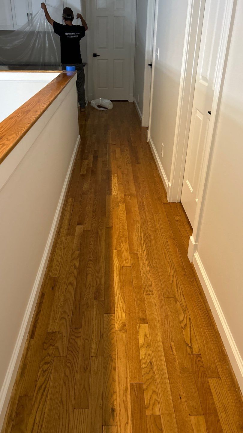 Updated staircase and hallway by Footprints Floors of Nashville