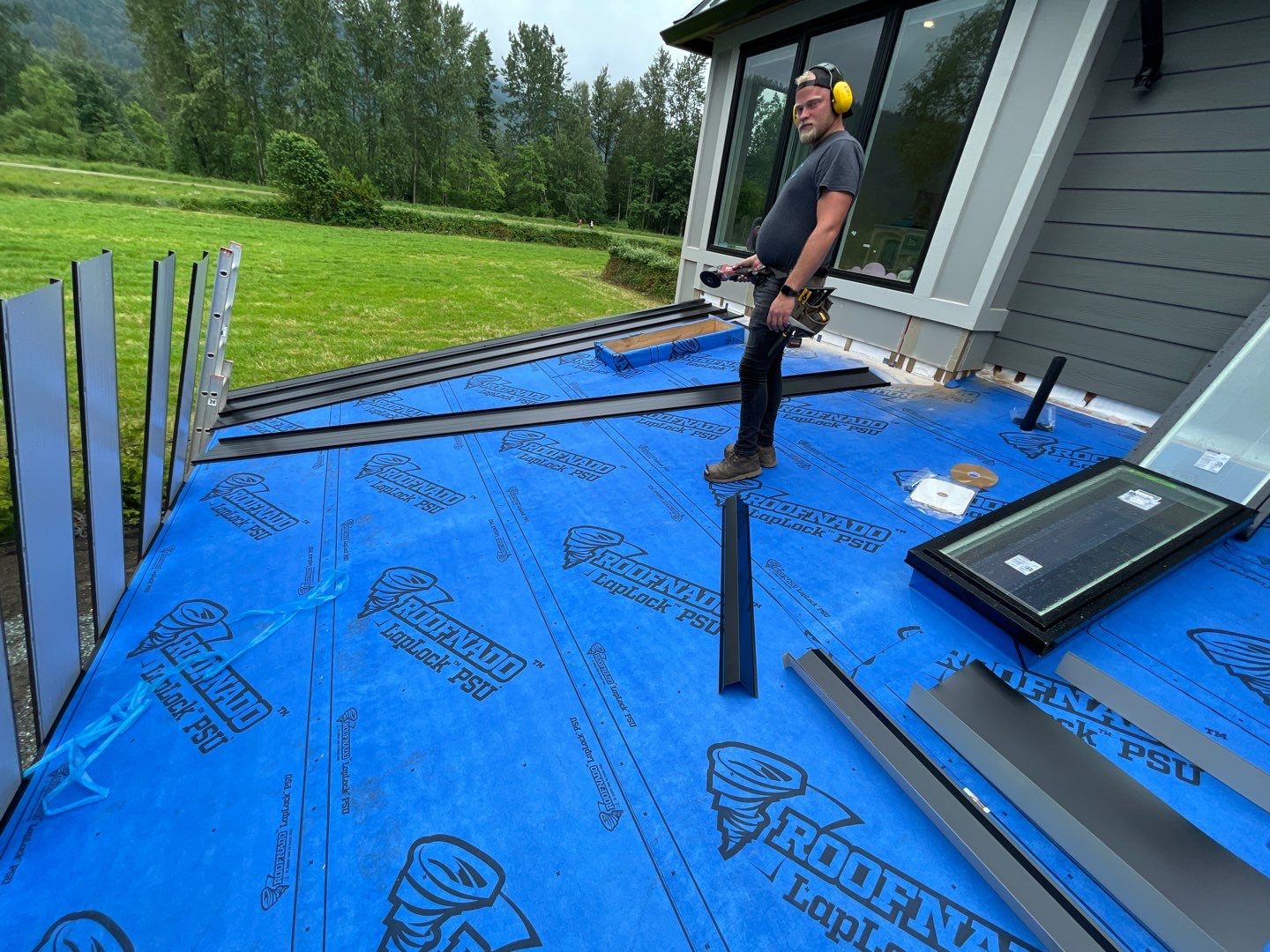 Commercial Roofing Installation using 12" Prolok metal  by Top Notch Roofing Inc