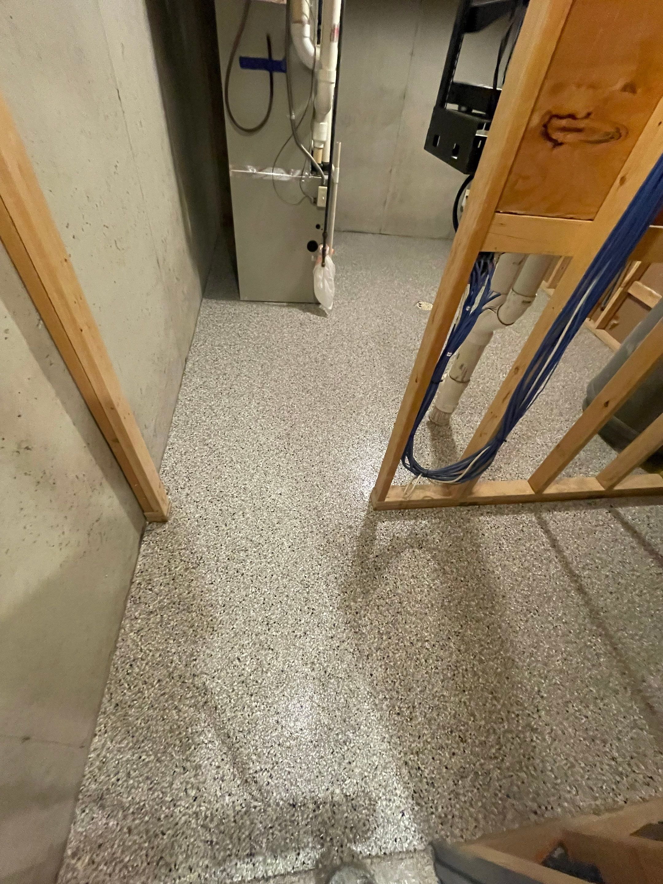 Sioux Falls Basement Floor Transformation with Durable Epoxy Flake Coating by Select Painting, Coatings & Garage Cabinets