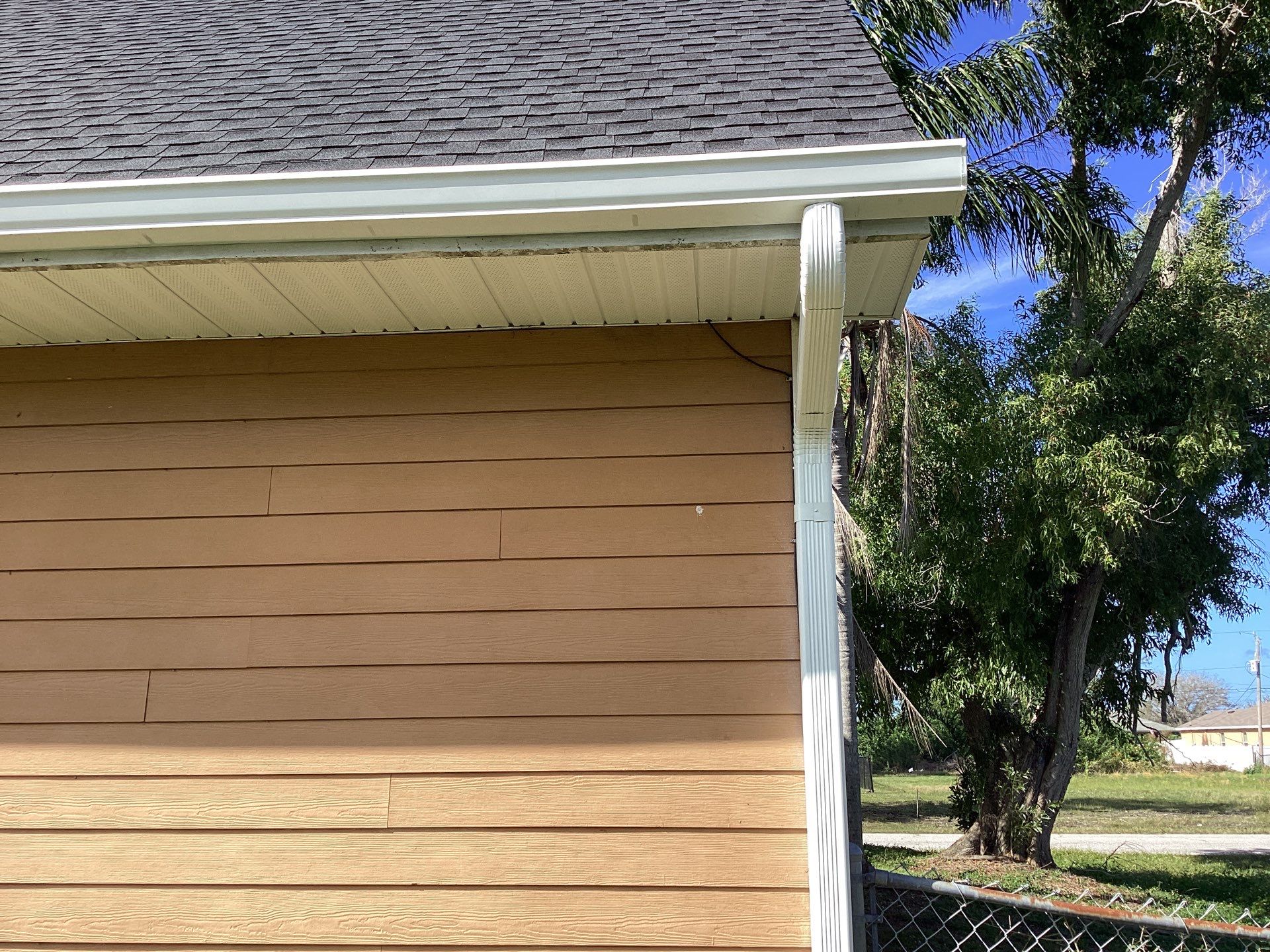 Soffit & Fascia White + New Downspouts by Gutter Professors