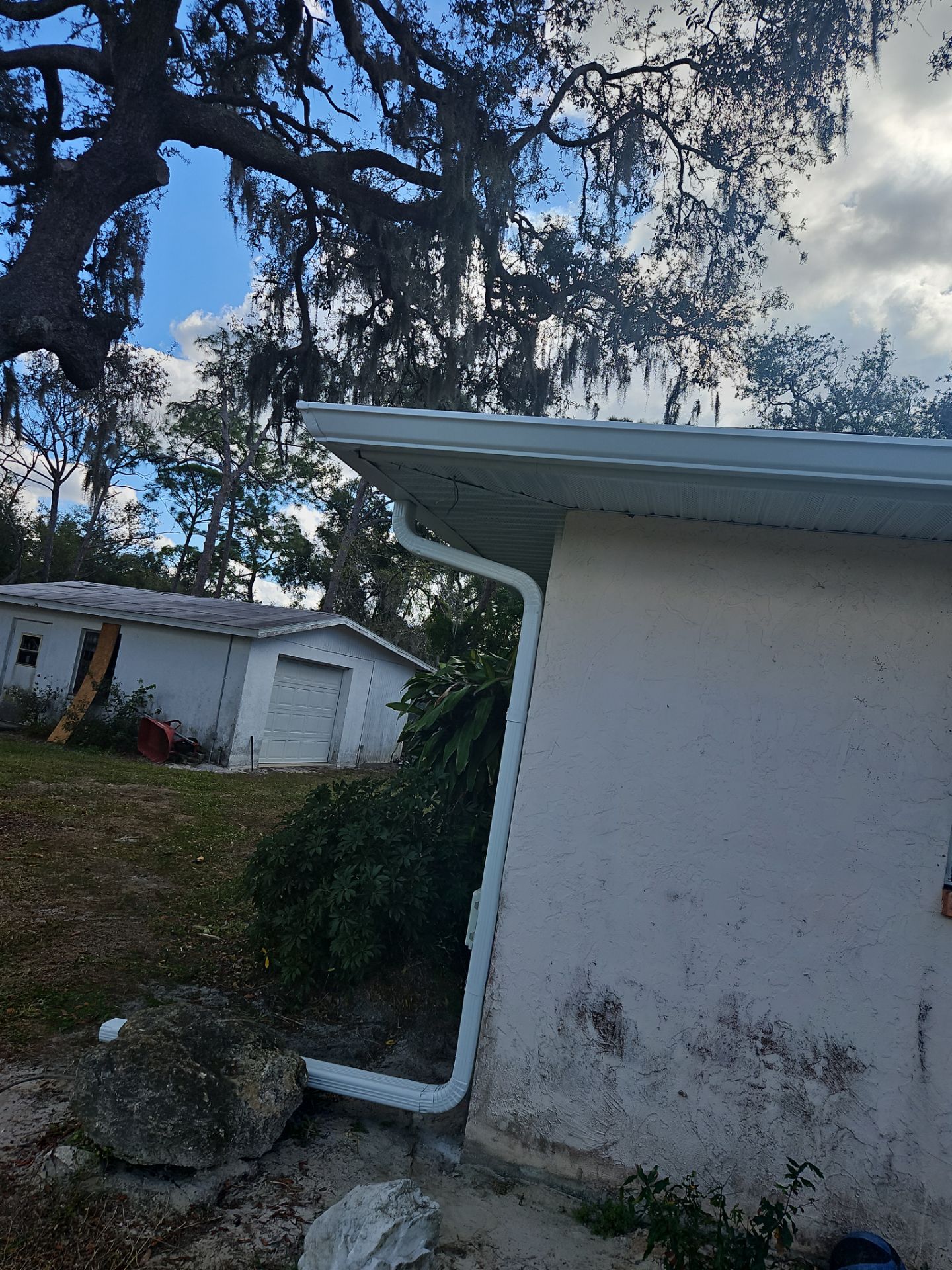 Downspout Installation using White Down Spouts in Sarasota FL by Gutter Professors