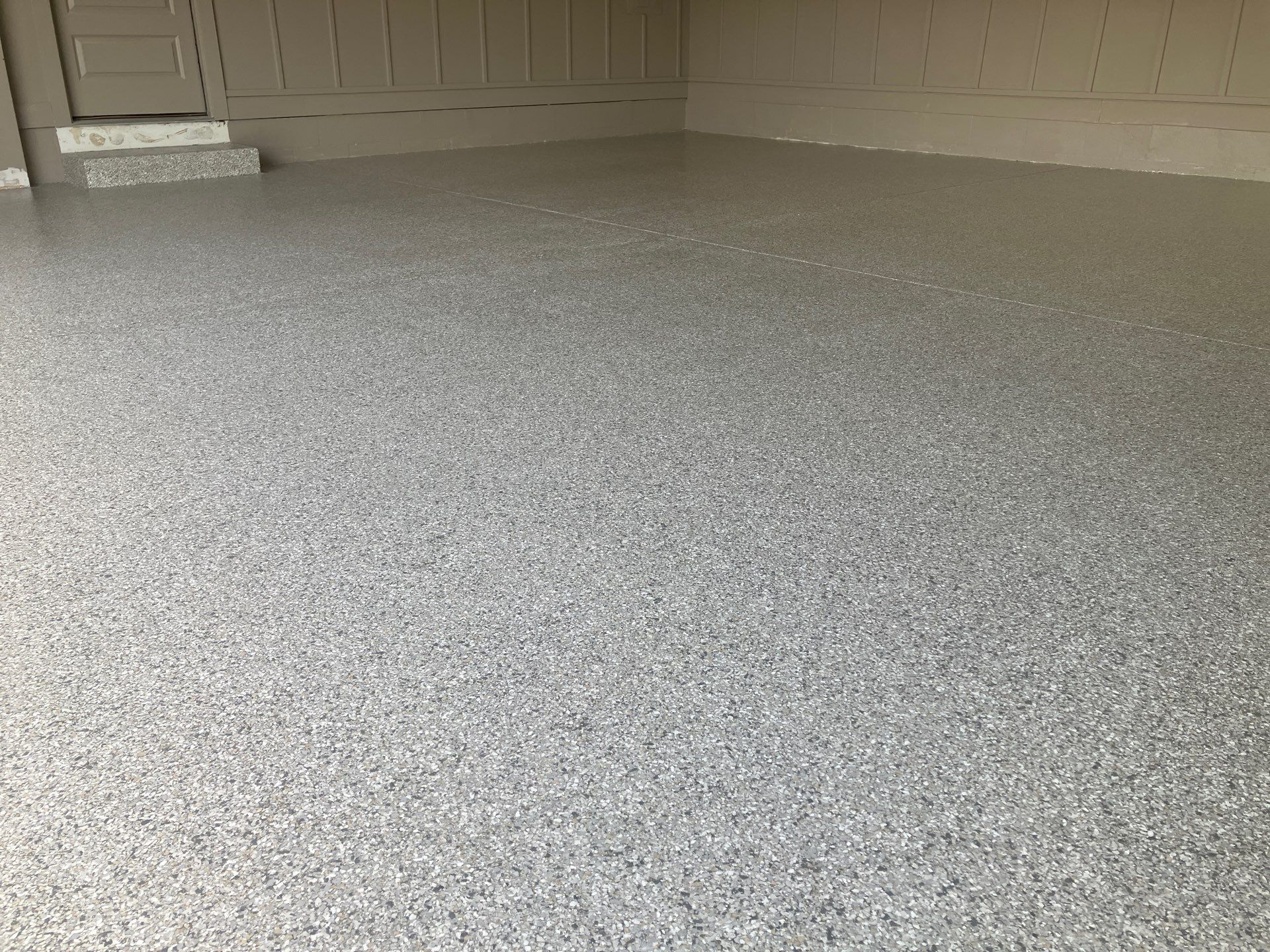 Garage in Mount Everest by Cross Creek Concrete Coatings