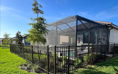 Aluminum Fence Installation using Bronze 3 Rail Aluminum Fence
