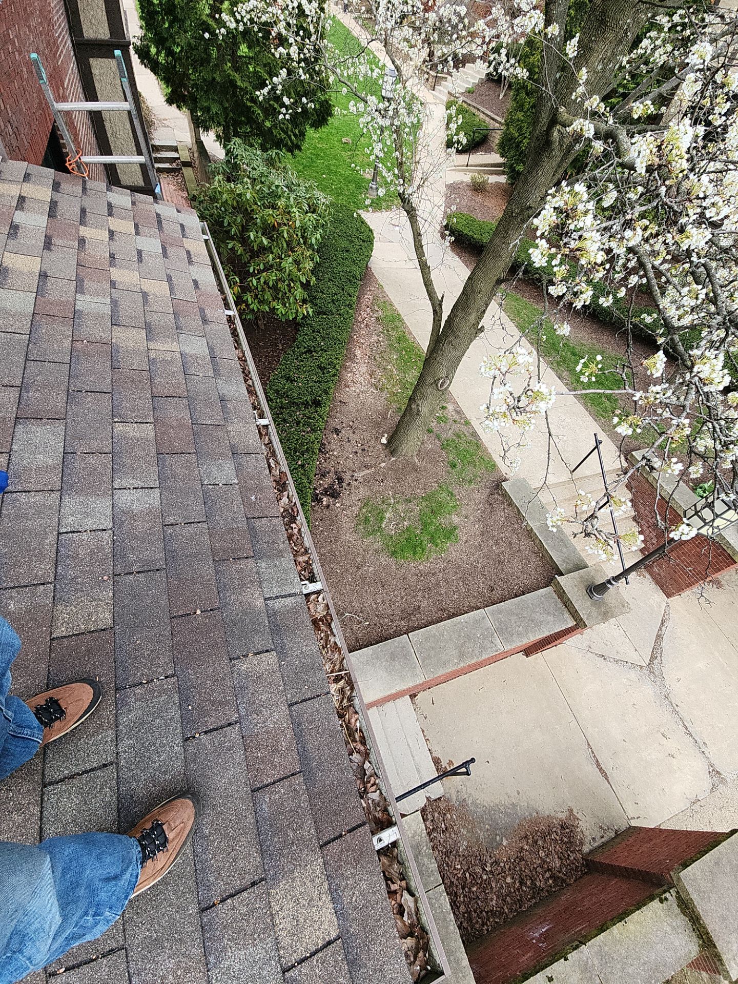 Commercial gutter cleaning Pittsburgh, PA before photo with filled gutters