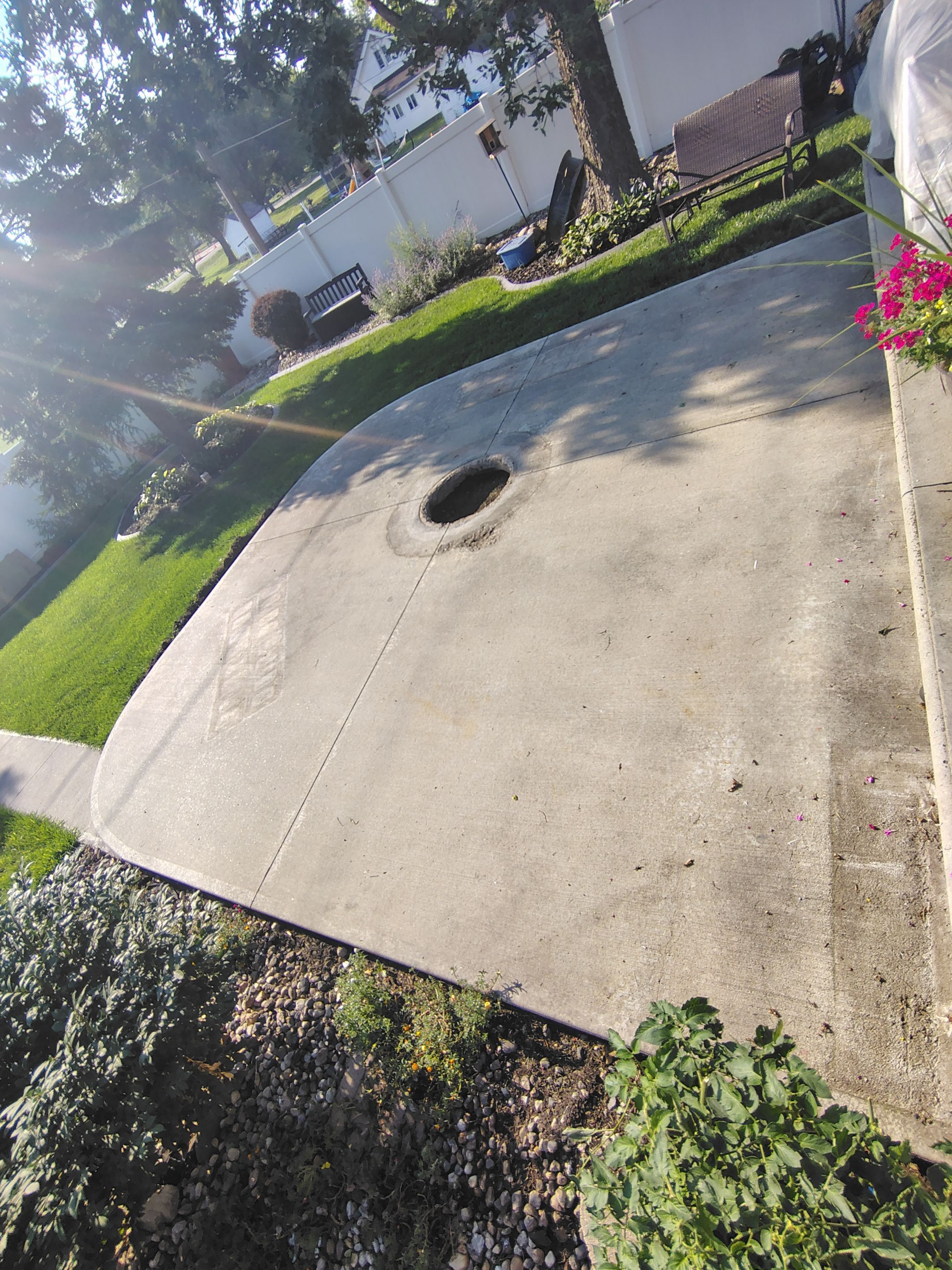 Custom Garage Floor Coating and Backyard Patio Refinishing in Tyndall by Select Painting, Coatings & Garage Cabinets