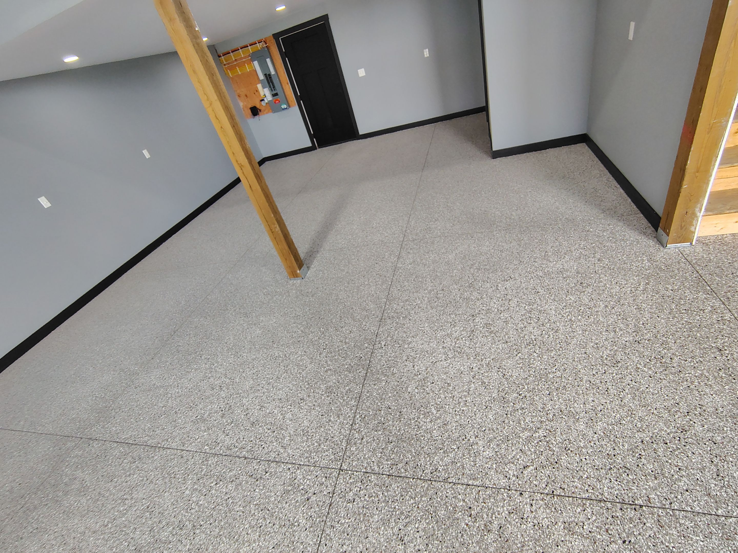 Polyaspartic Garage Floor Coating with Decorative Flake in Wentworth by Select Painting, Coatings & Garage Cabinets