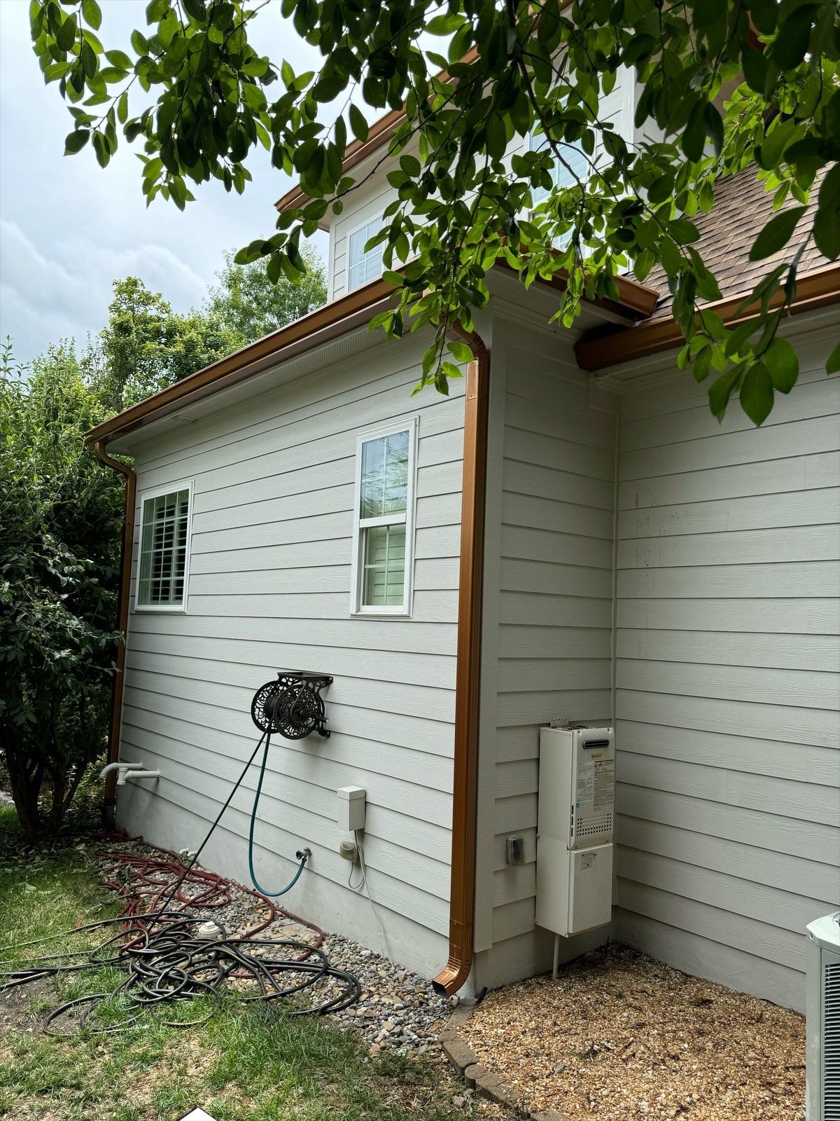 Roof Replacement - GAF Timberline HDZ Shakewood - 6” coppertone seamless gutters by Pro Performance Roofing