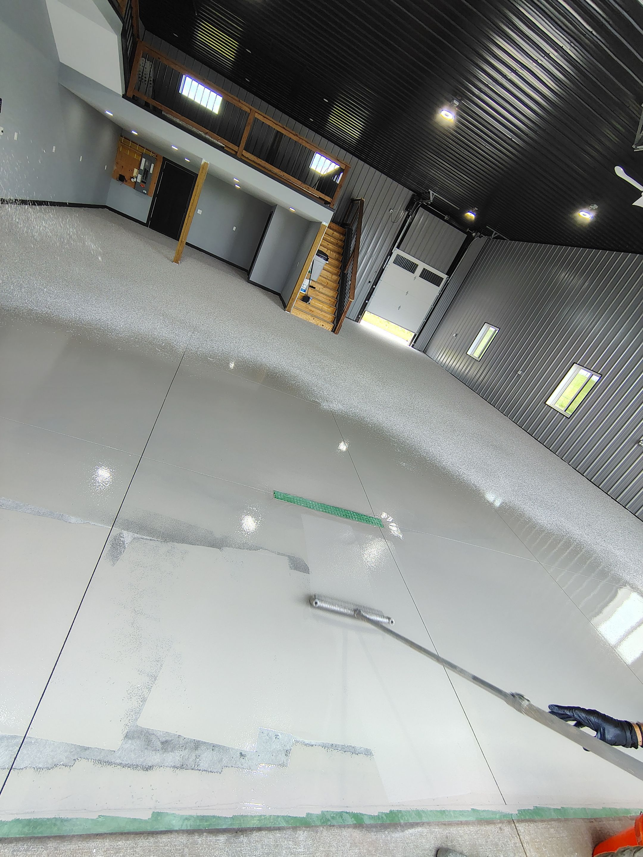 Polyaspartic Garage Floor Coating with Decorative Flake in Wentworth by Select Painting, Coatings & Garage Cabinets