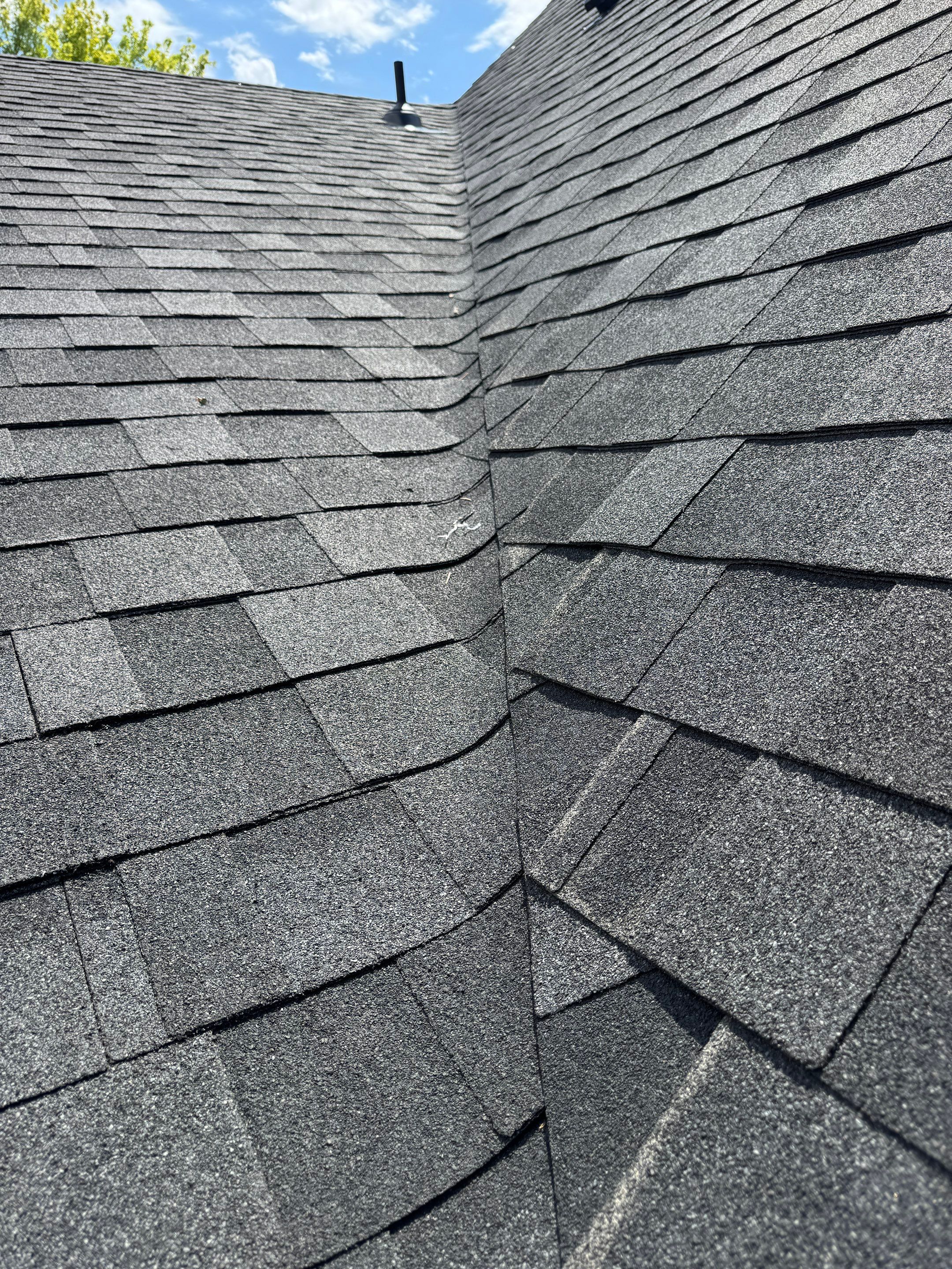 Residential Roof Replacement Featuring Charcoal Grey Architectural Shingles by Olive Roofing