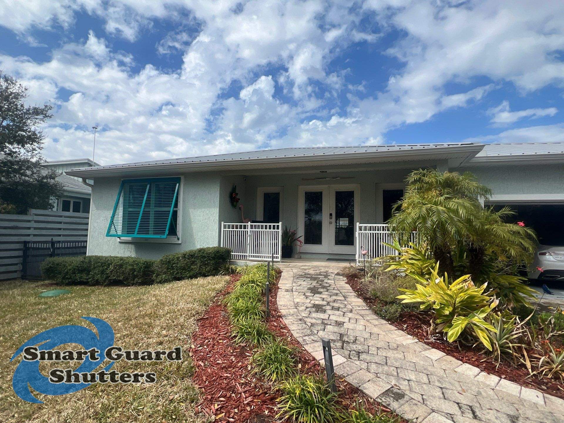 Impact Bahama Shutters in Water Blue by Smart Guard Shutters