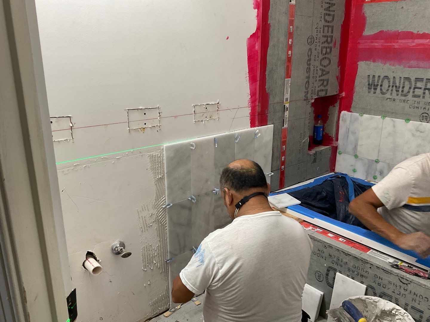 Bathroom Remodel using Two new bathroom design and new floors by Alpha Design Services