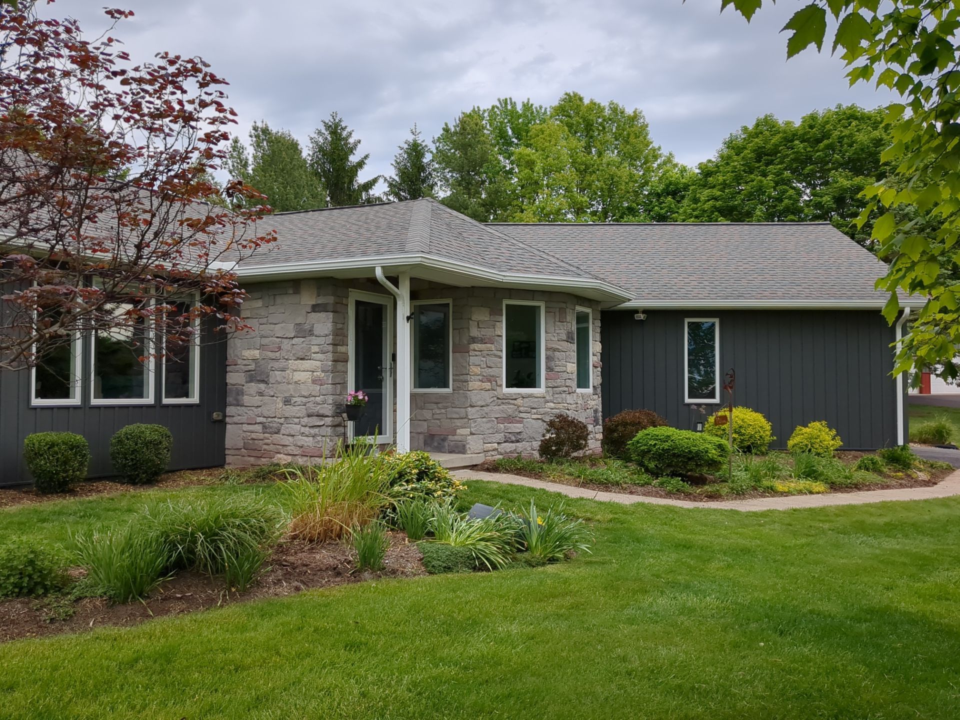 Nightfall Exterior Siding Replacement and Stone Veneer in Halifax by Esh Builders