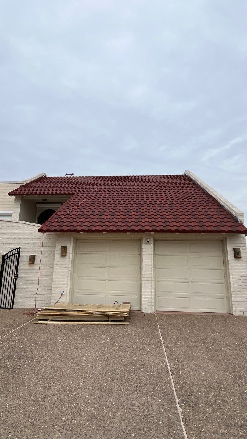 Off with the Tile and on with the TILCOR stone coated metal.  by Bayfront Roofing and Construction