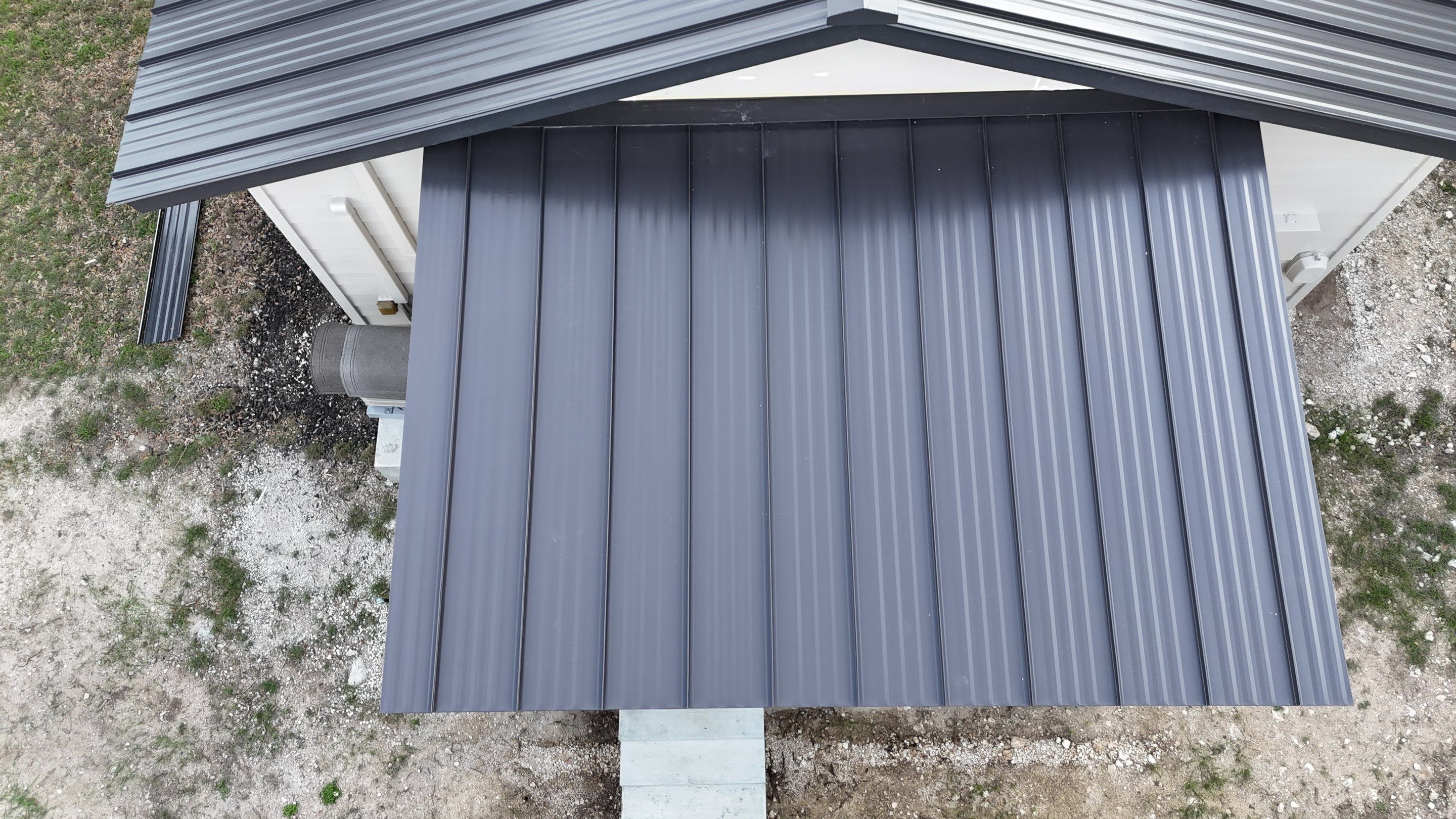 Dark Bronze Fully Striated panel by Wimberley Roofing