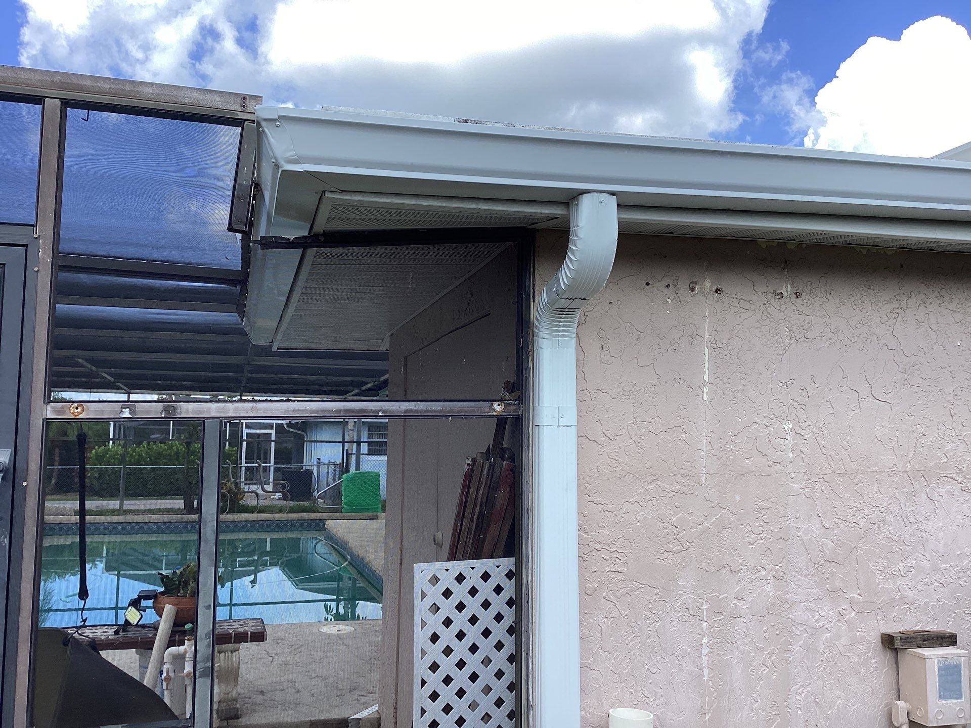 White Seamless Gutters and Splash Guards in Fort Myers FL by Gutter Professor by Gutter Professors