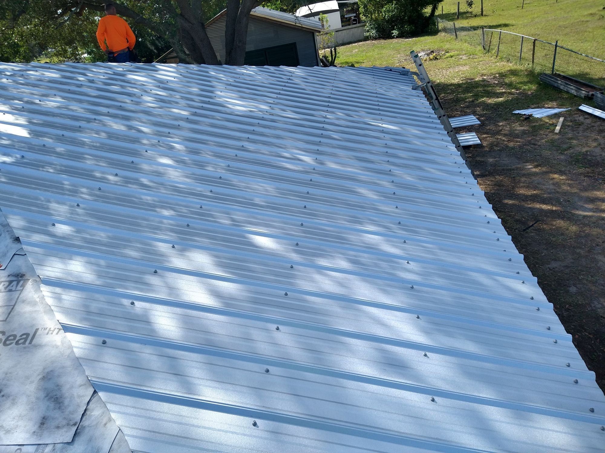 Residential Roofing Installation using 26 GA Rib Panel Galvalume by 1st Class Roofing, Inc.