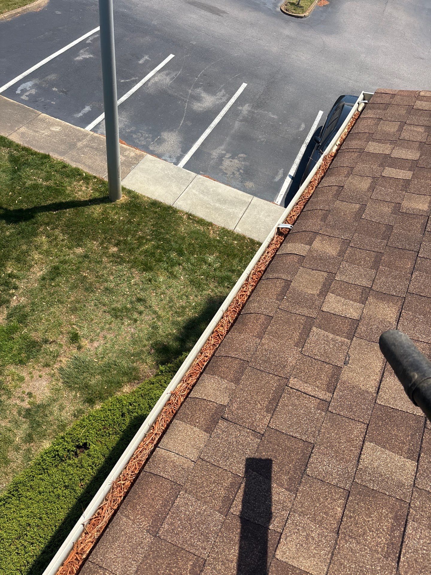 Commercial gutter cleaning Virginia Beach & Norfolk before photo with filled gutters