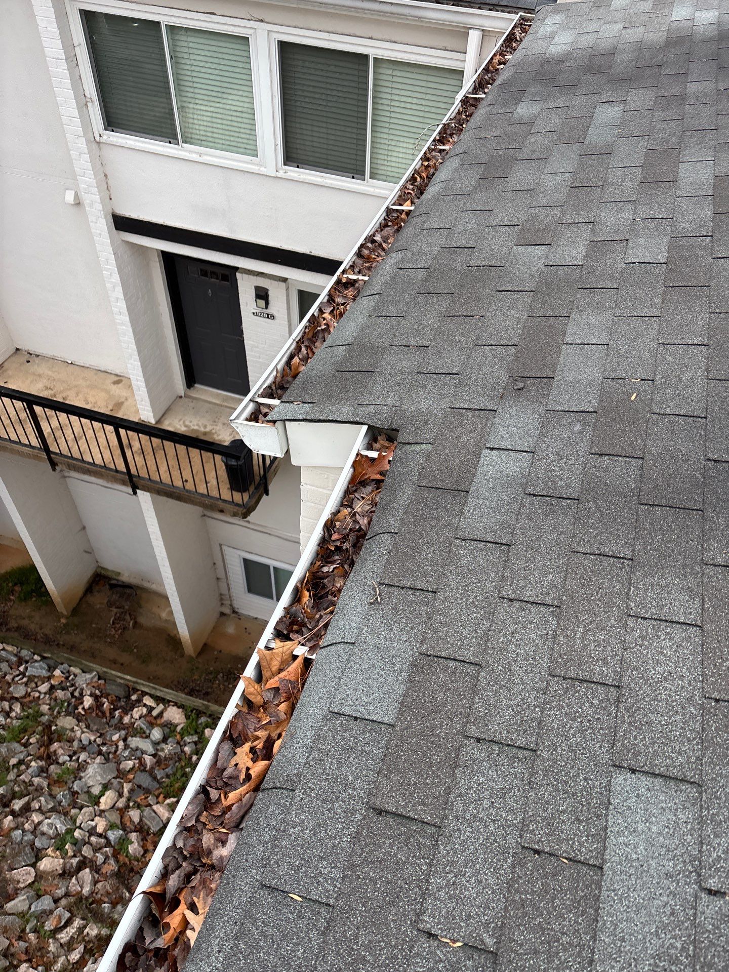 Commercial gutter cleaning Raleigh, NC before photo with filled gutters